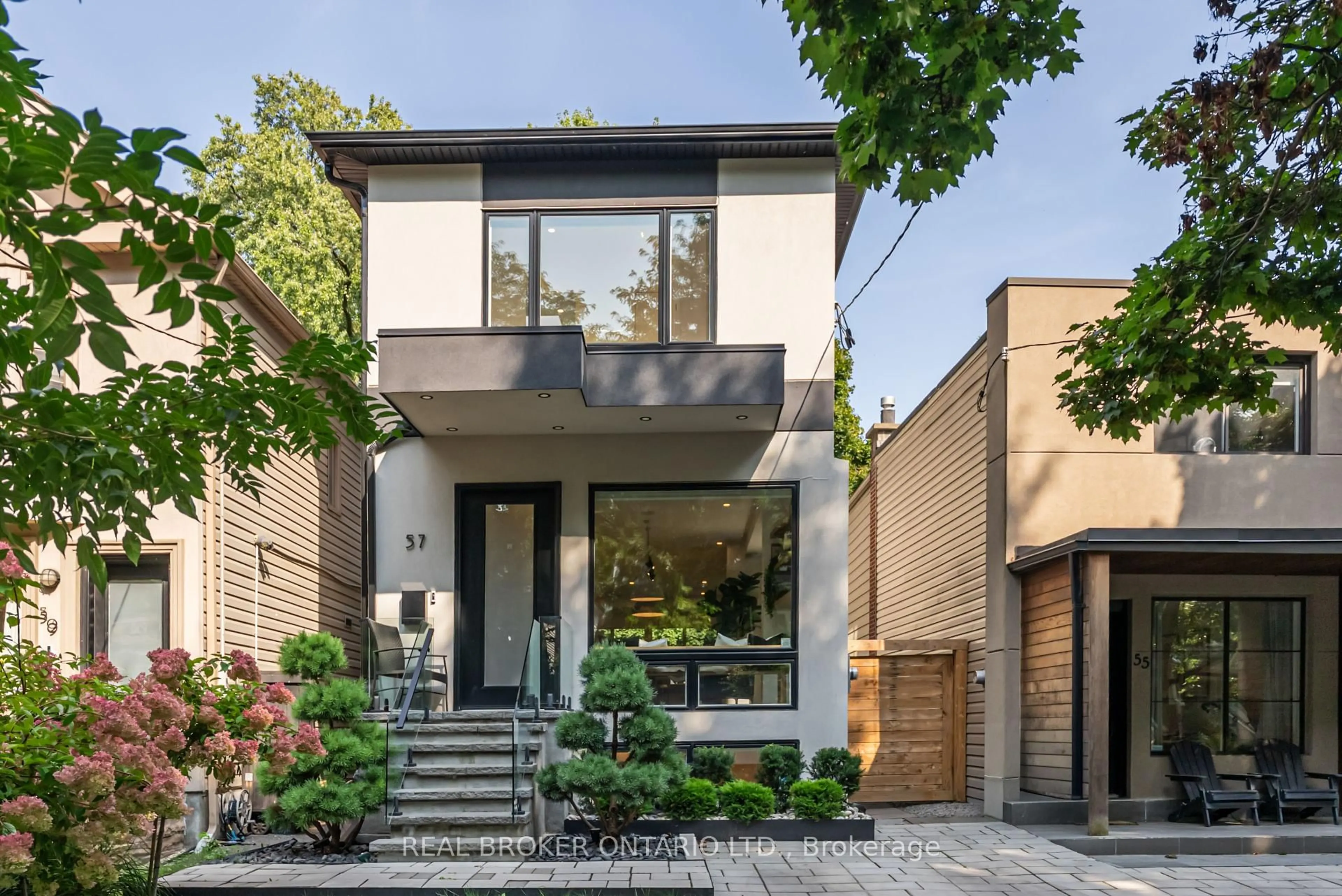 Home with brick exterior material, street for 57 Rhodes Ave, Toronto Ontario M4L 2Z8