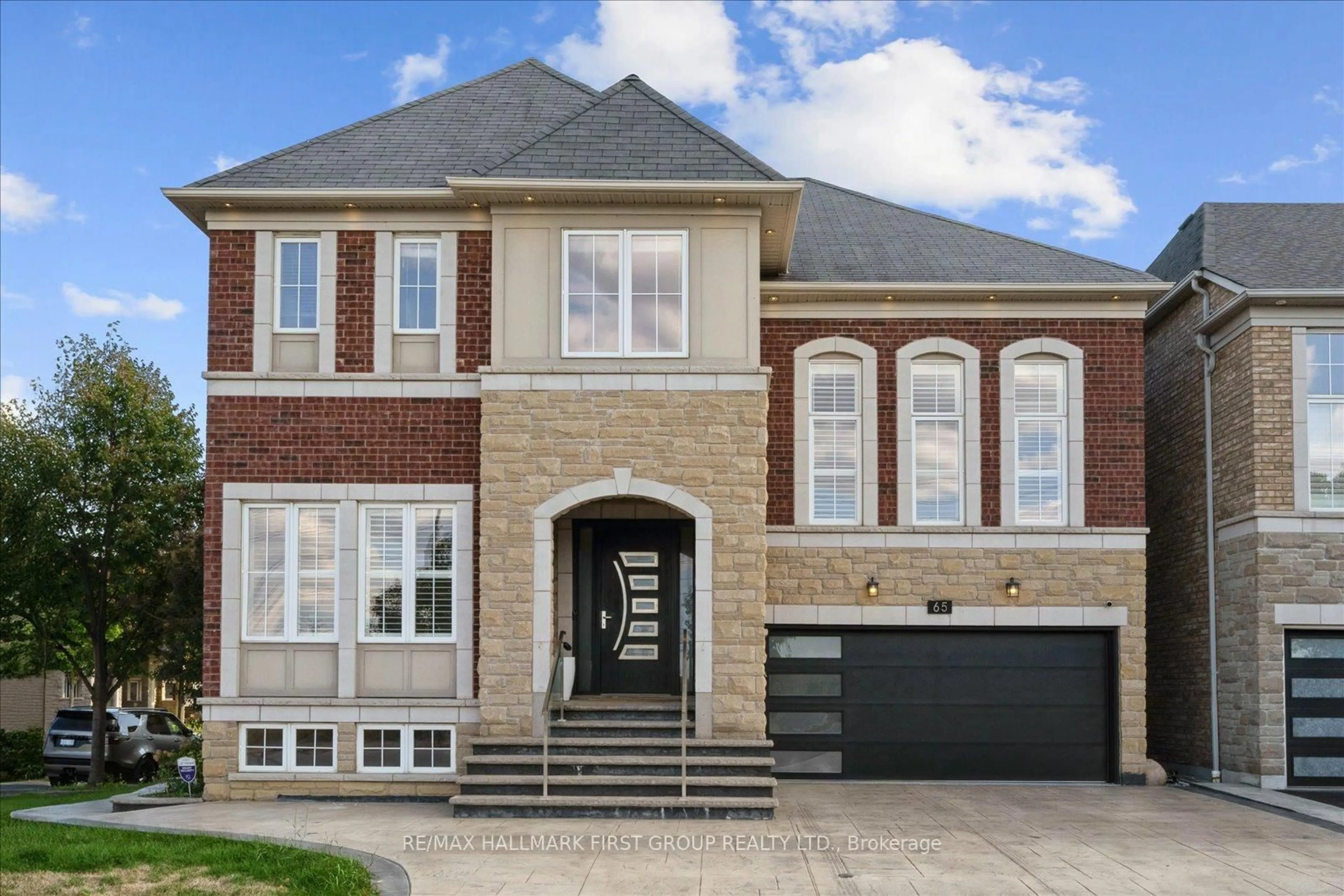 Home with brick exterior material, street for 65 Booker Dr, Ajax Ontario L1Z 0J4
