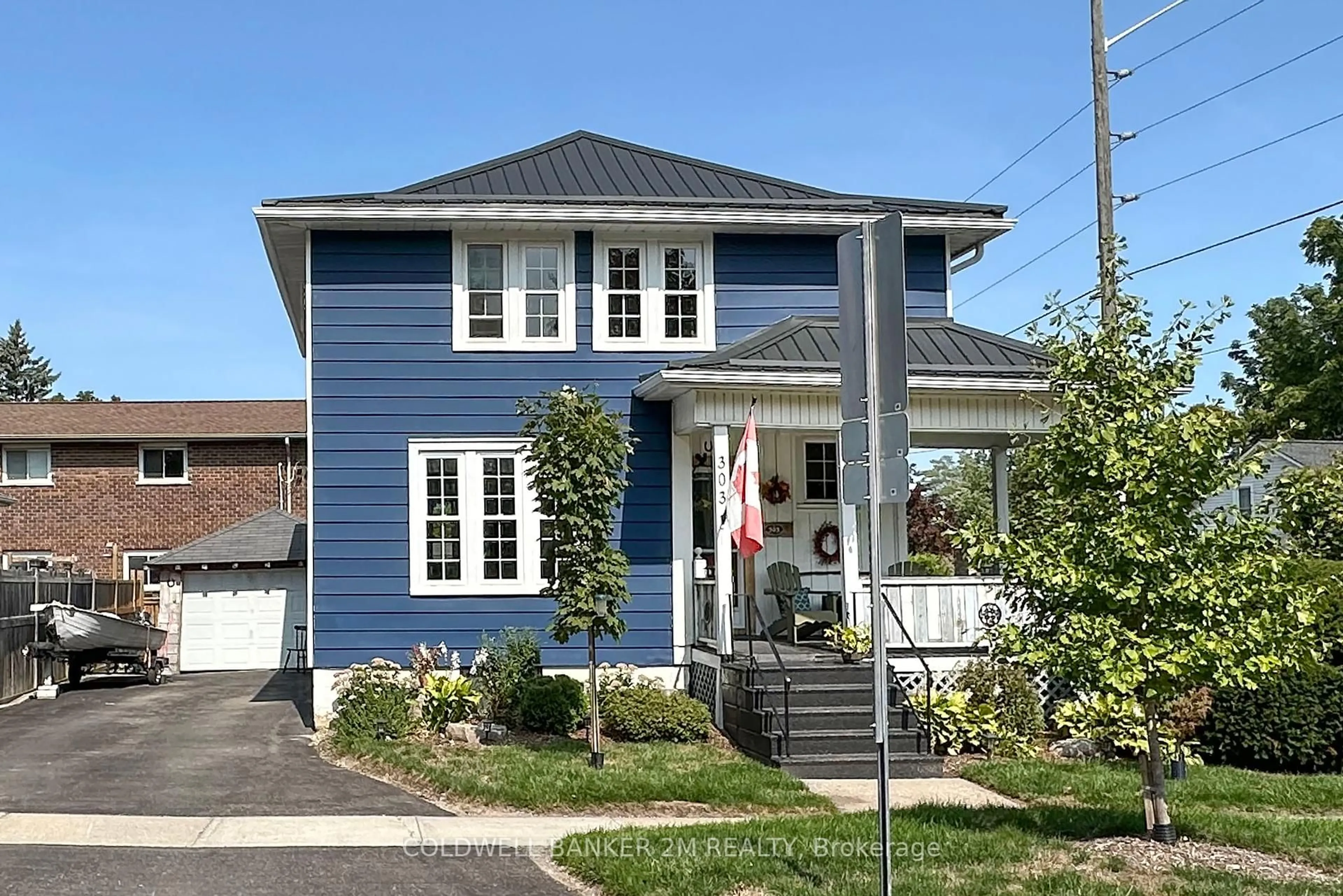 Home with vinyl exterior material, street for 303 McDonald St, Scugog Ontario L9L 1L6