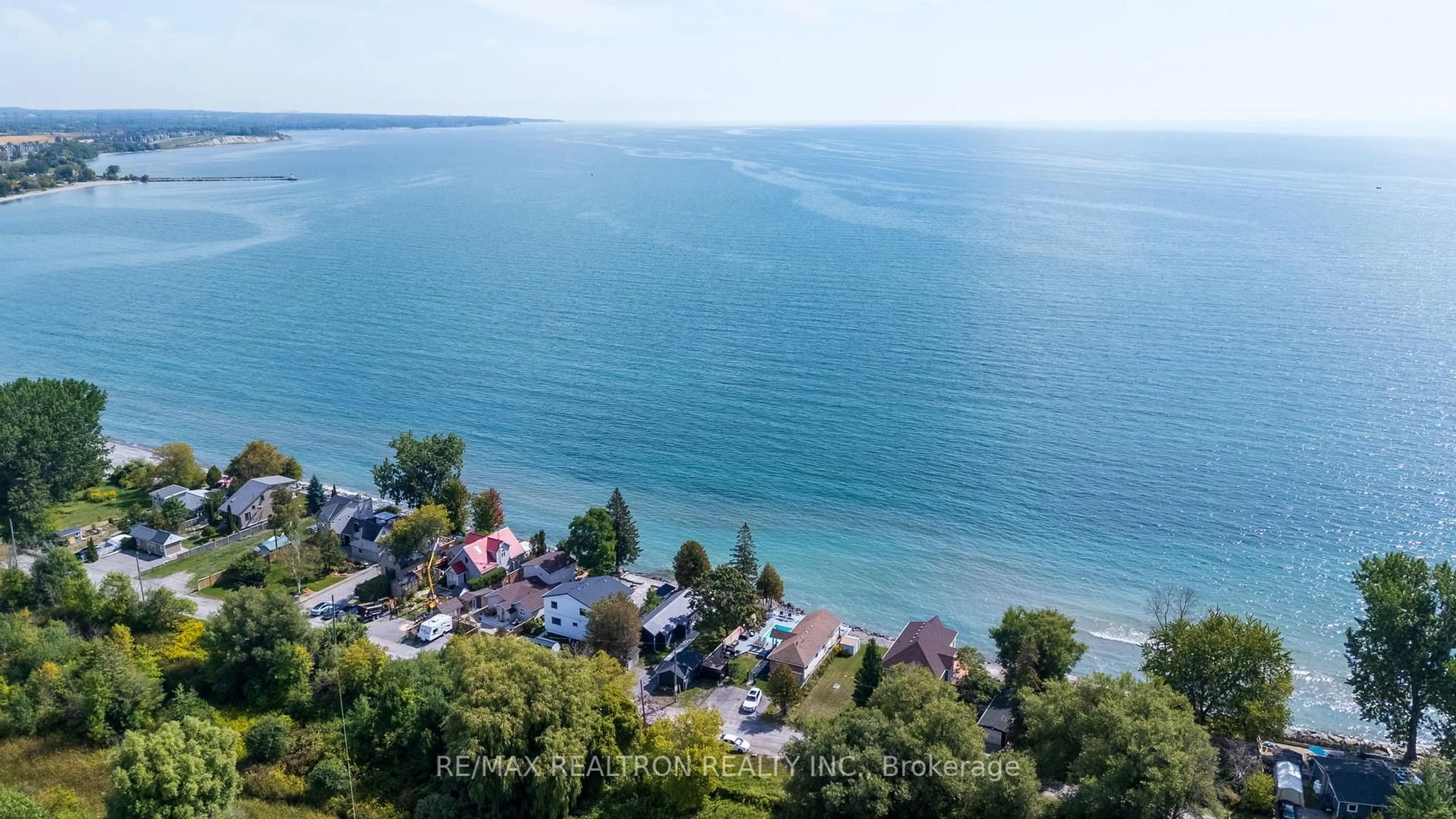 A pic from outside/outdoor area/front of a property/back of a property/a pic from drone, water/lake/river/ocean view for 63 Cedar Crest Beach Rd, Clarington Ontario L1C 3K3