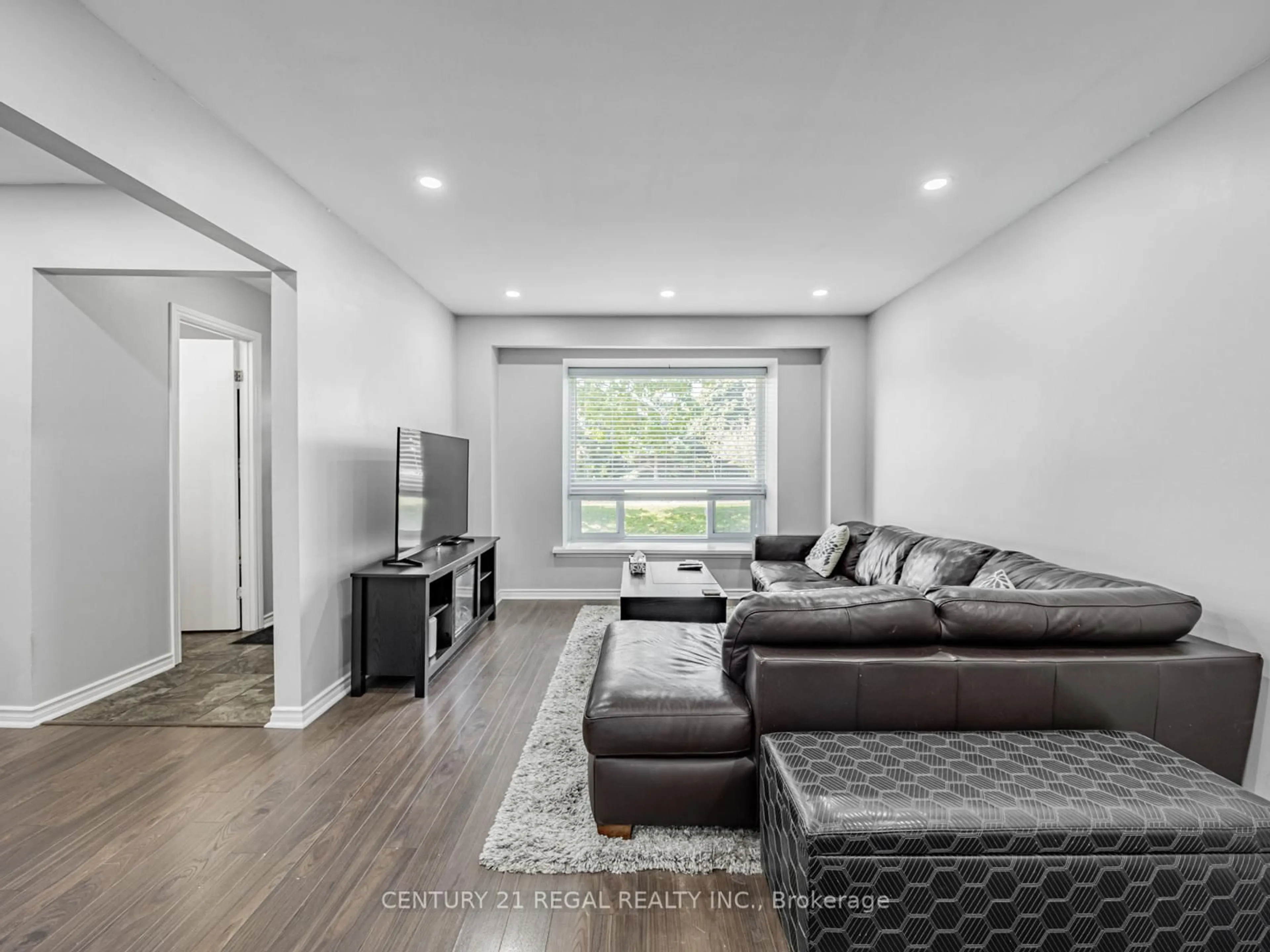 Living room with furniture, wood/laminate floor for 4 Groves Lane, Ajax Ontario L1S 3C8