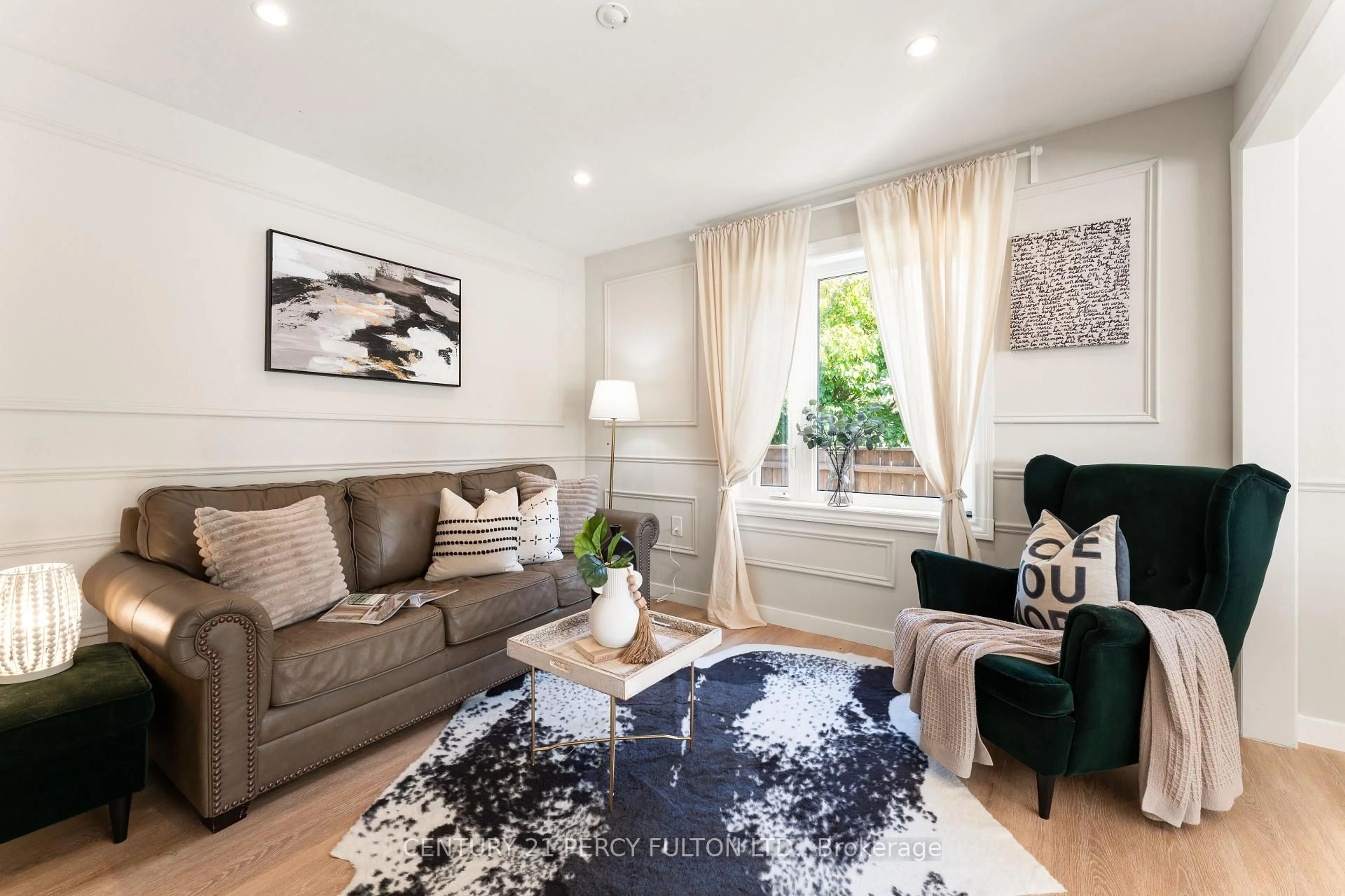 Living room with furniture, wood/laminate floor for 34 Topham Rd, Toronto Ontario M4B 3K2