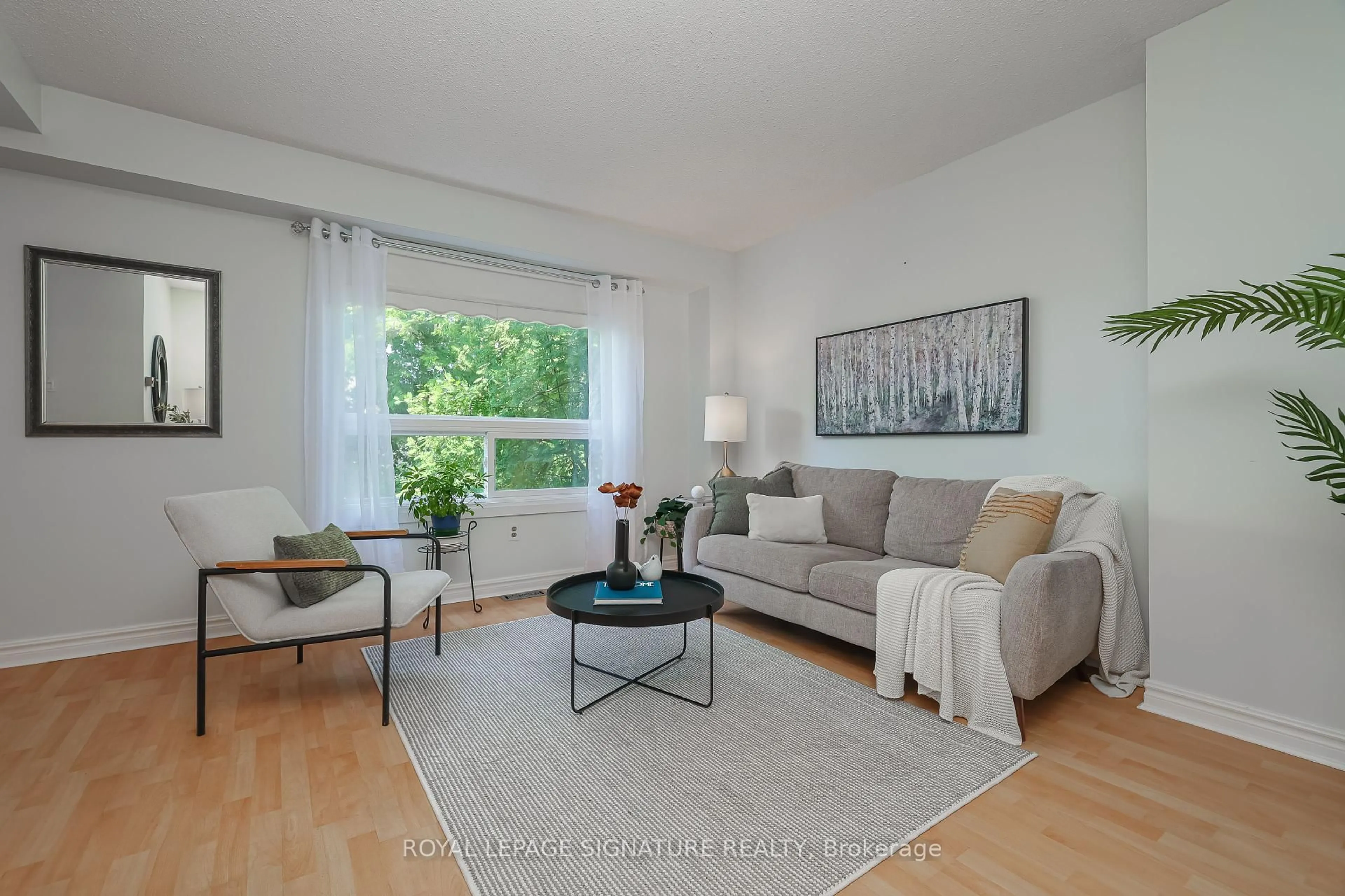 Living room with furniture, wood/laminate floor for 56 Muirlands Dr, Toronto Ontario M1V 2B4