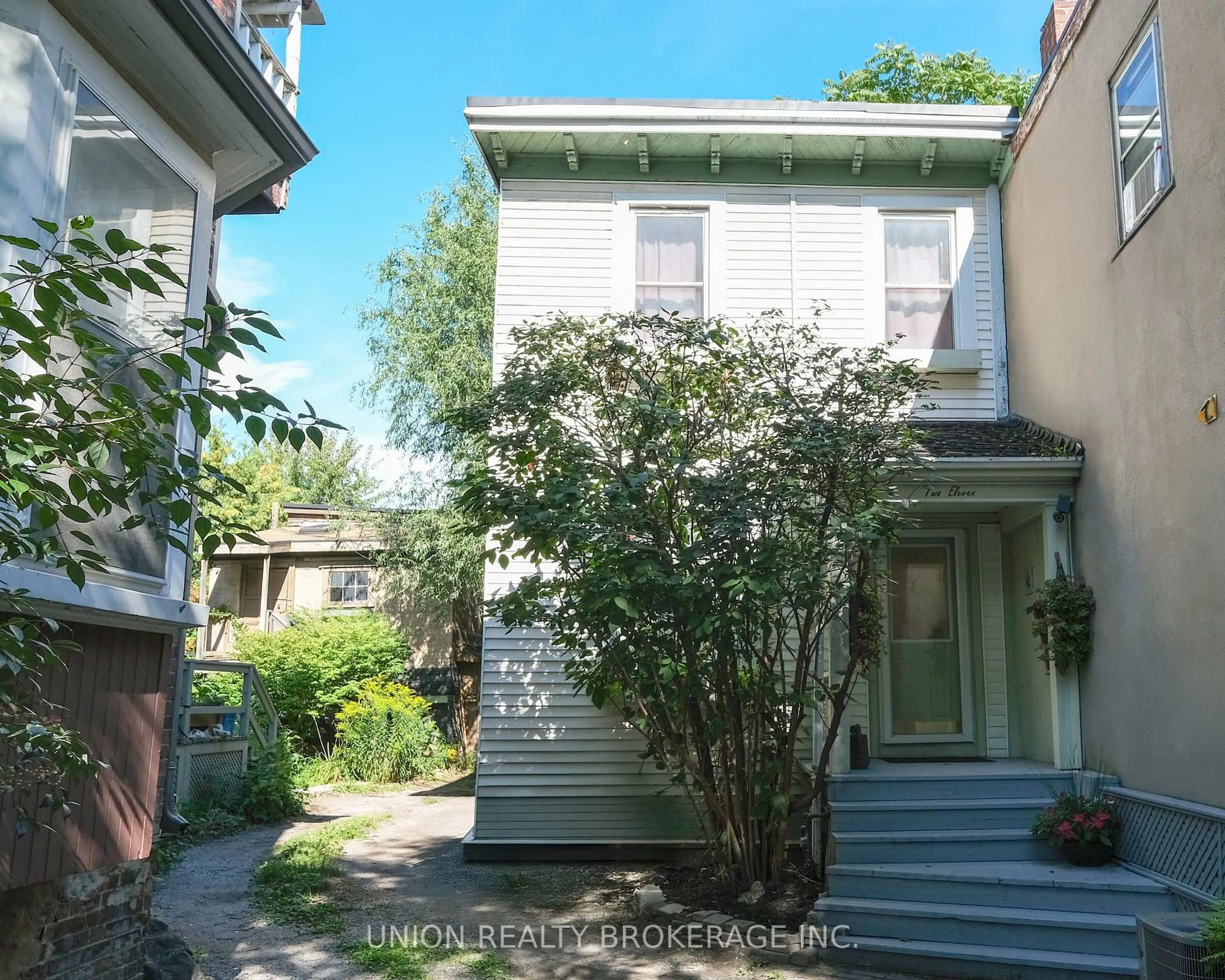 A pic from outside/outdoor area/front of a property/back of a property/a pic from drone, street for 211 De Grassi St, Toronto Ontario M4M 2K8