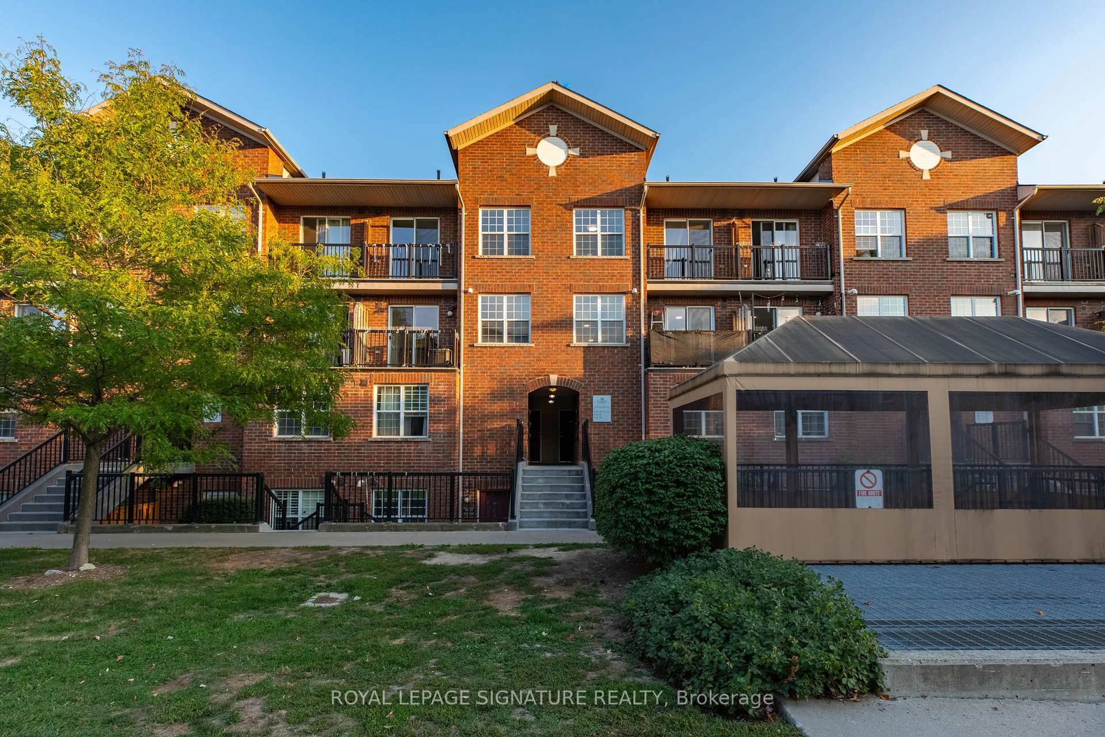 A pic from outside/outdoor area/front of a property/back of a property/a pic from drone, unknown for 45 Strangford Lane #309, Toronto Ontario M1L 0E5