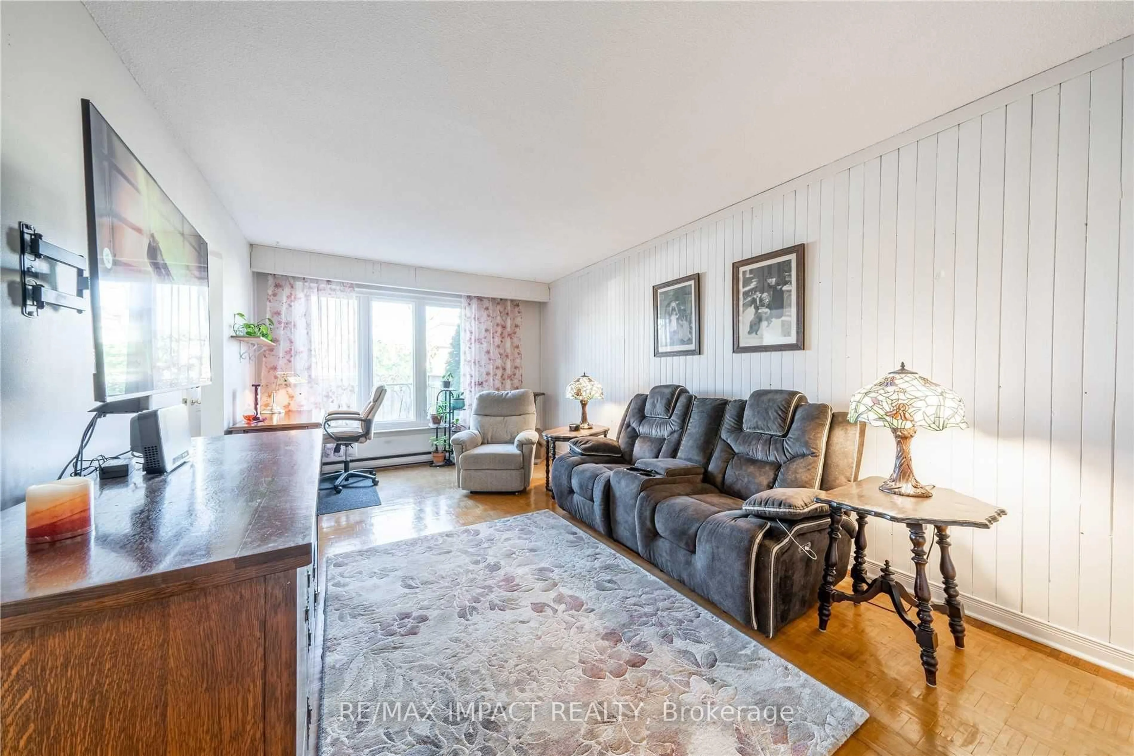 Living room with furniture, wood/laminate floor for 33 Taunton Rd #28, Oshawa Ontario L1G 3T6