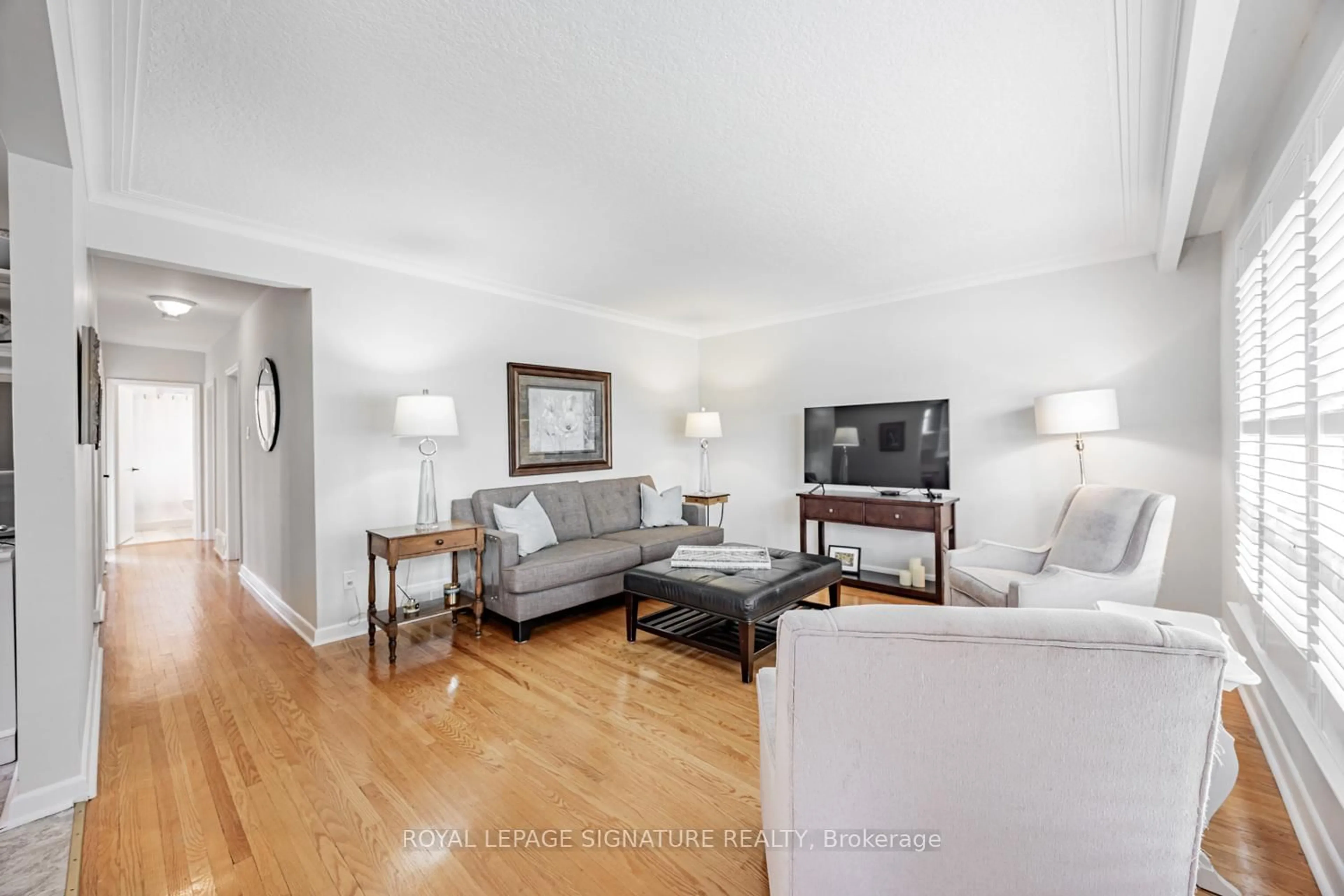 Living room with furniture, wood/laminate floor for 19 Brian Ave, Toronto Ontario M1R 3J1