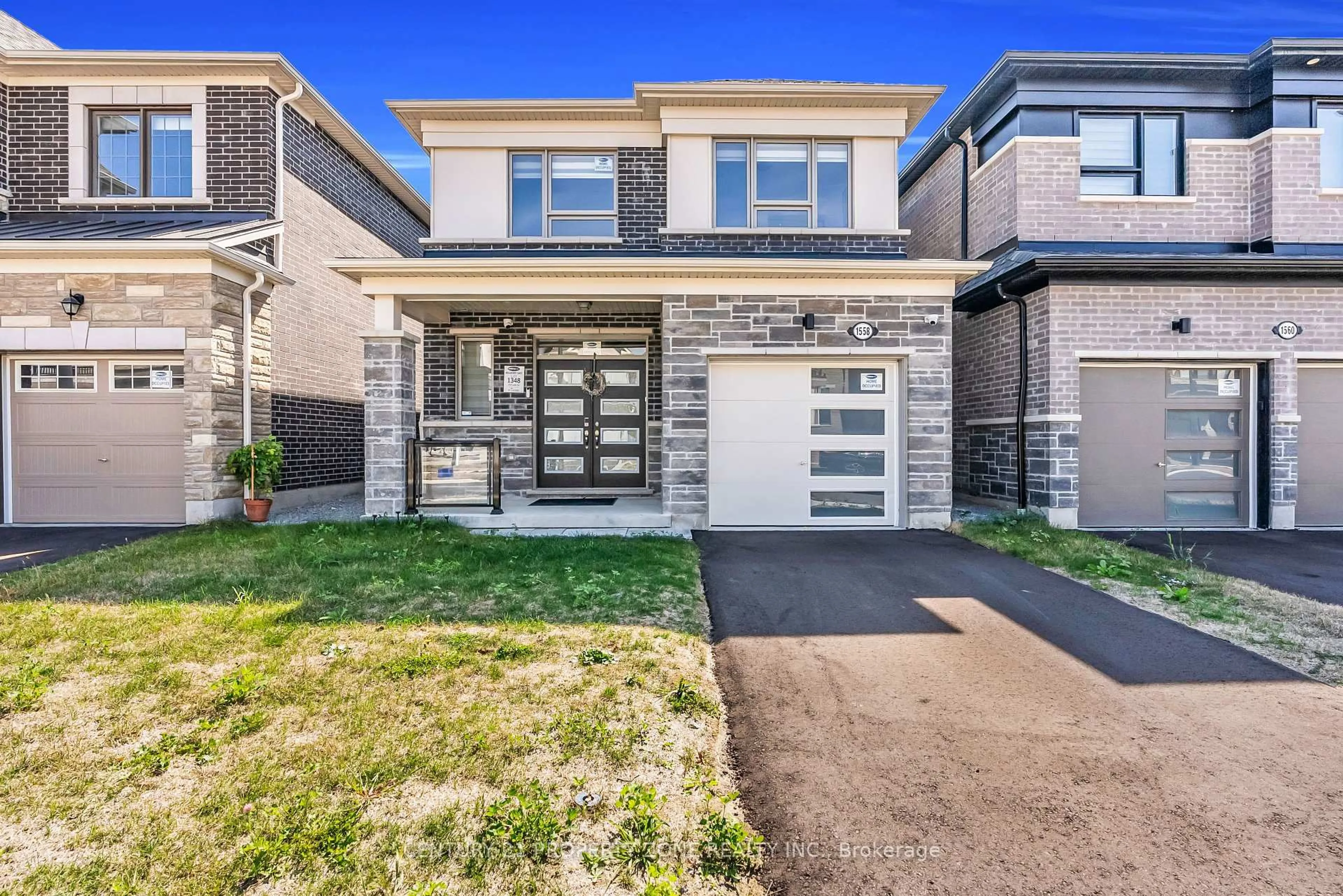 Home with brick exterior material, street for 1558 Scarlett Tr, Pickering Ontario L1X 0N9