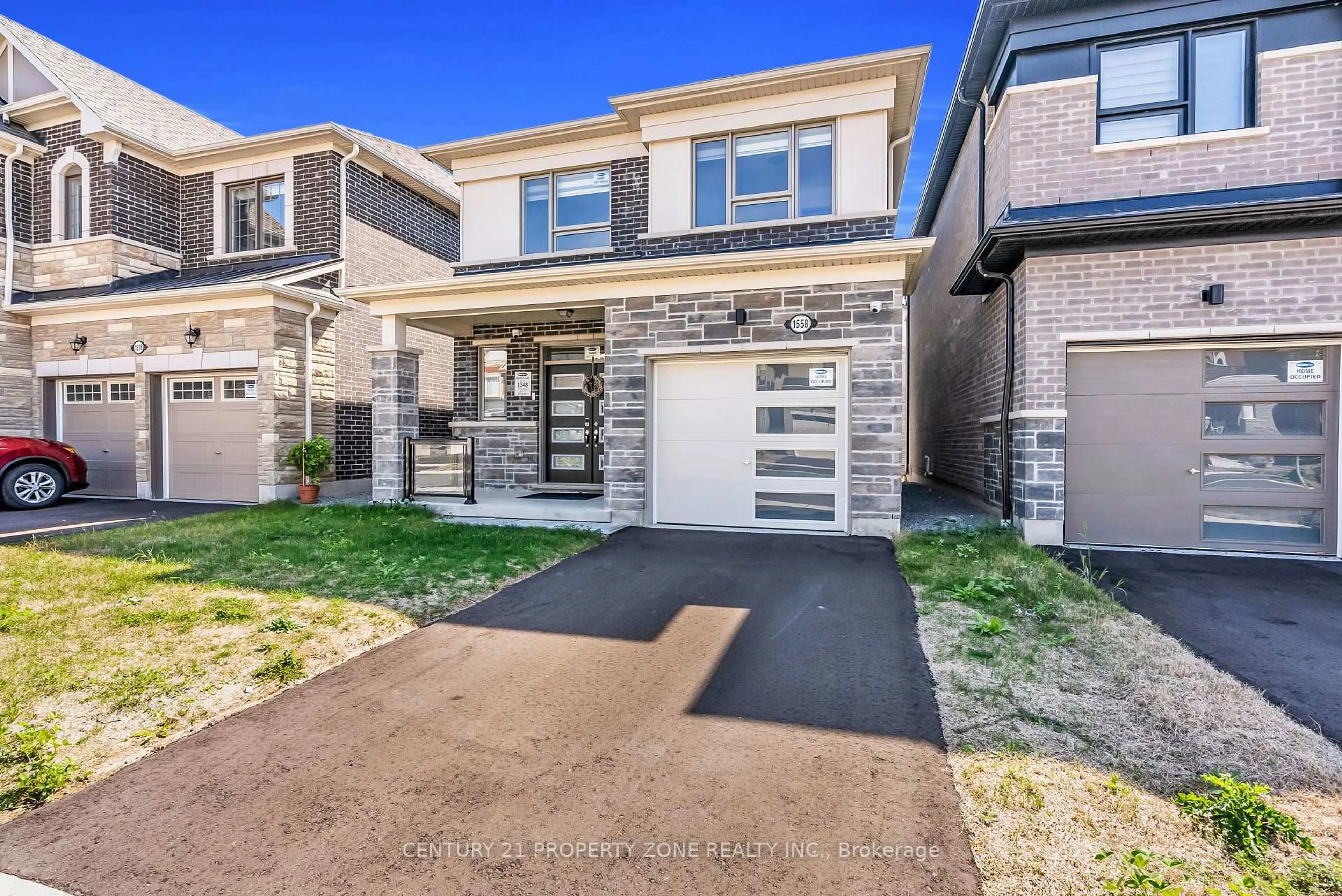 Home with brick exterior material, street for 1558 Scarlett Tr, Pickering Ontario L1X 0N9