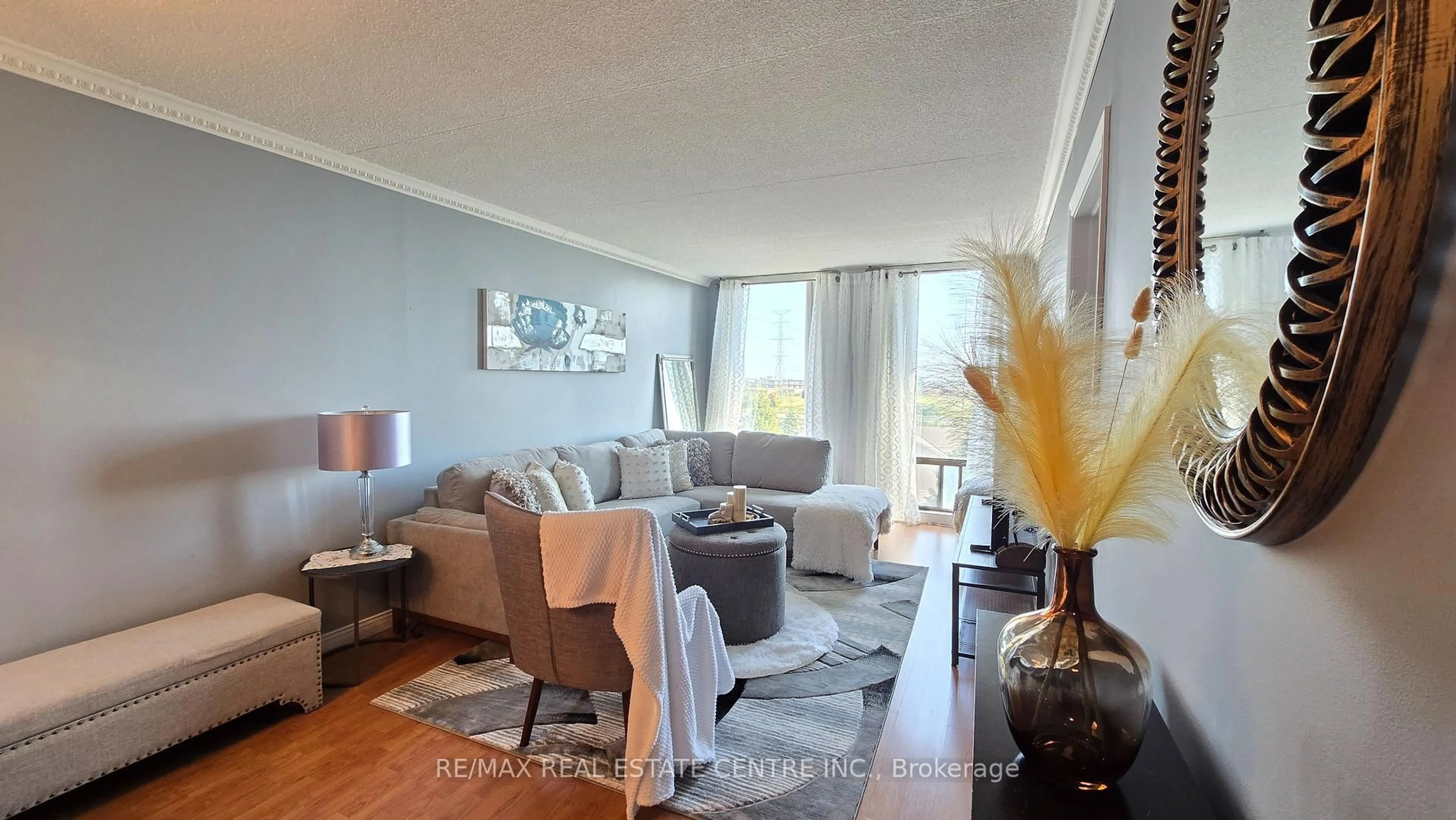Living room with furniture, wood/laminate floor for 1540 Pickering Pkwy #609, Pickering Ontario L1V 3V9