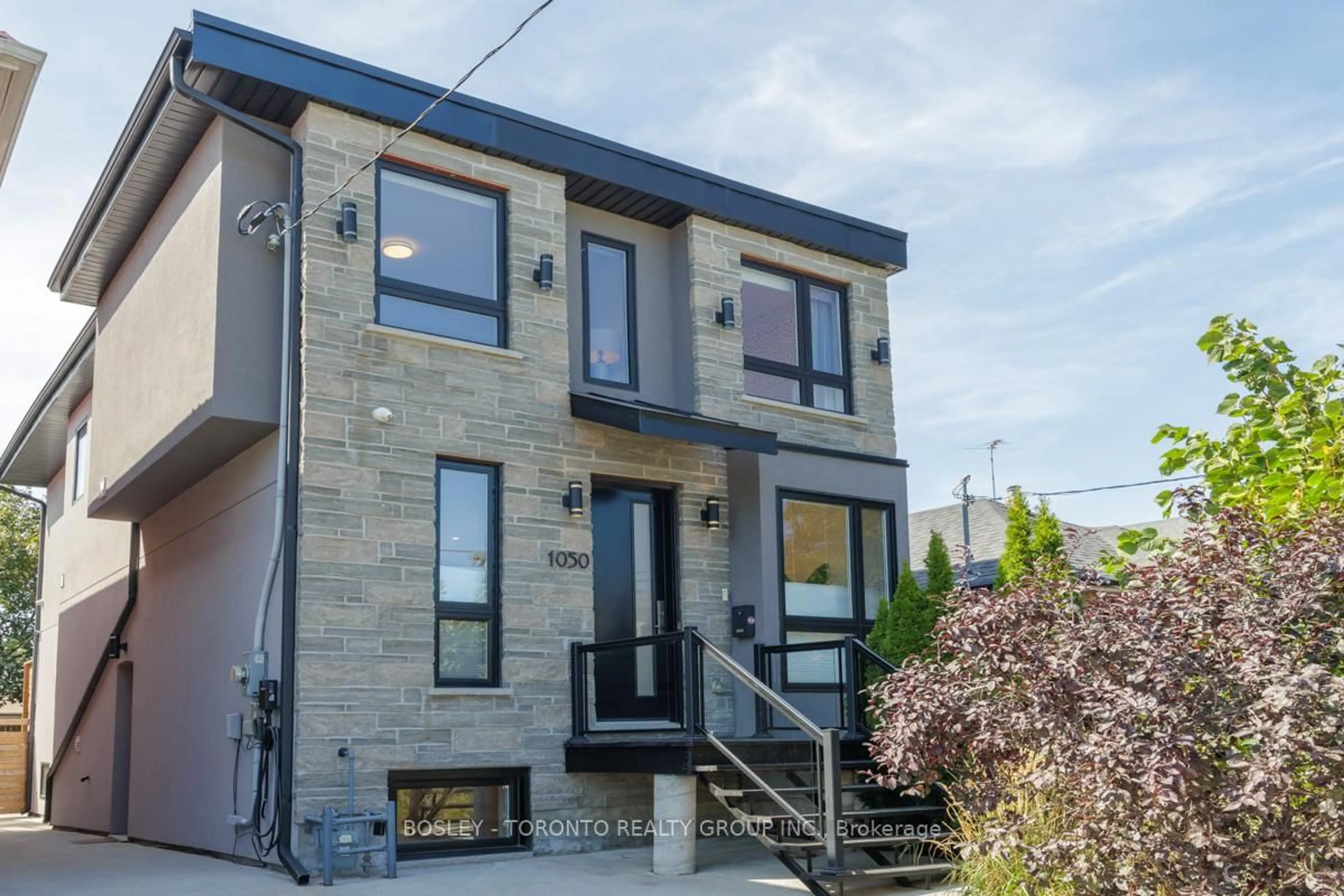 Home with brick exterior material, street for 1050 Greewood Ave, Toronto Ontario M4J 4E1