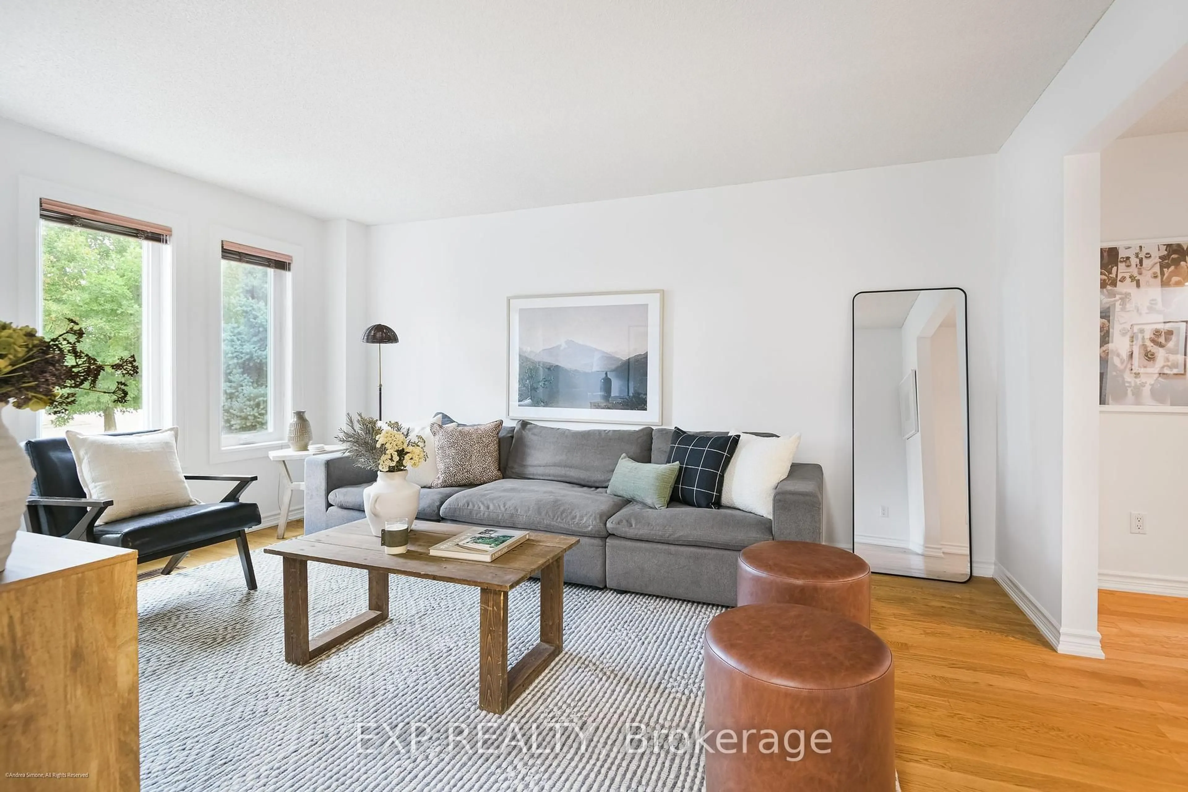Living room with furniture, wood/laminate floor for 505 Rosebank Rd, Pickering Ontario L1W 2N6
