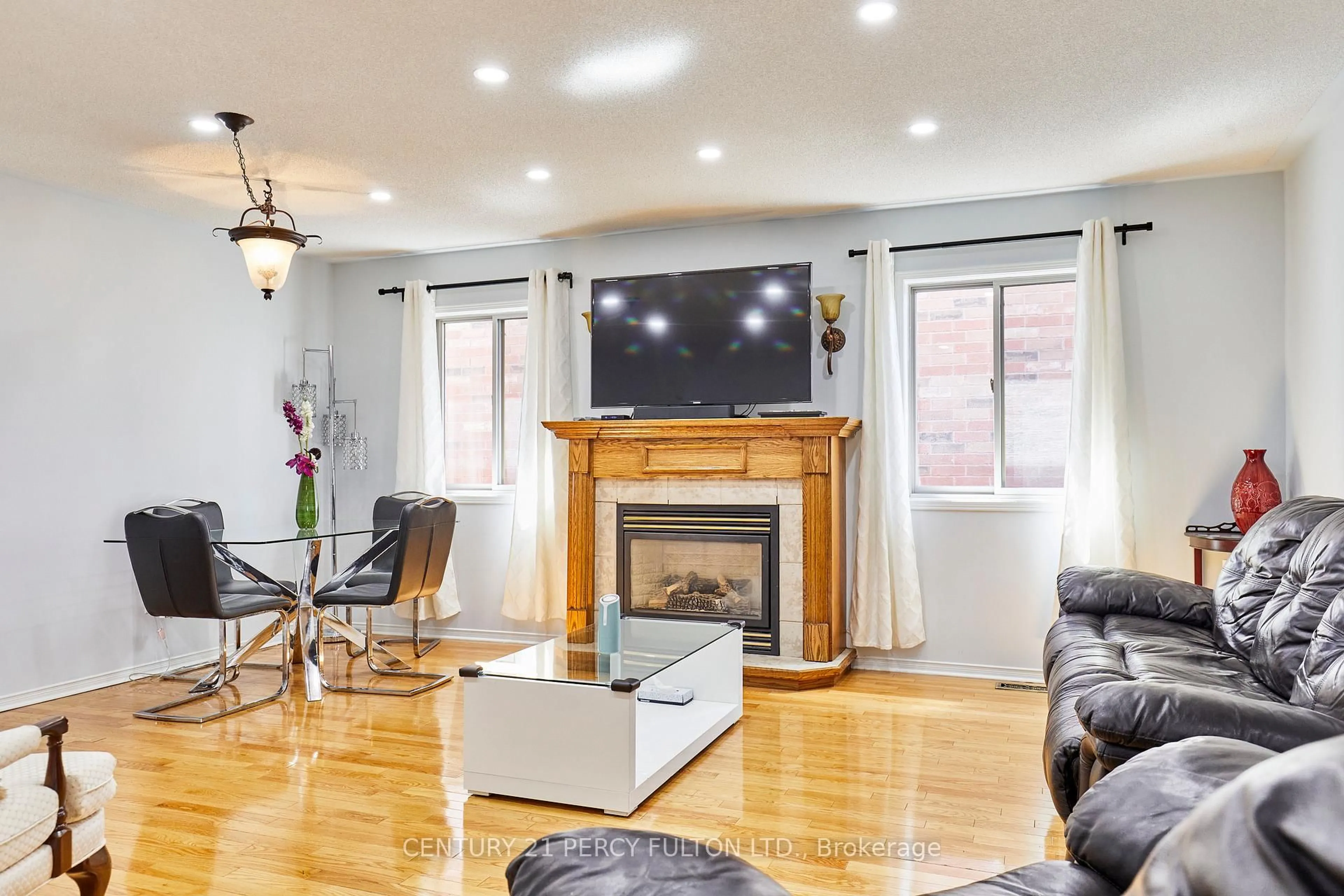 Living room with furniture, wood/laminate floor for 483 Ormond Dr, Oshawa Ontario L1K 2L8