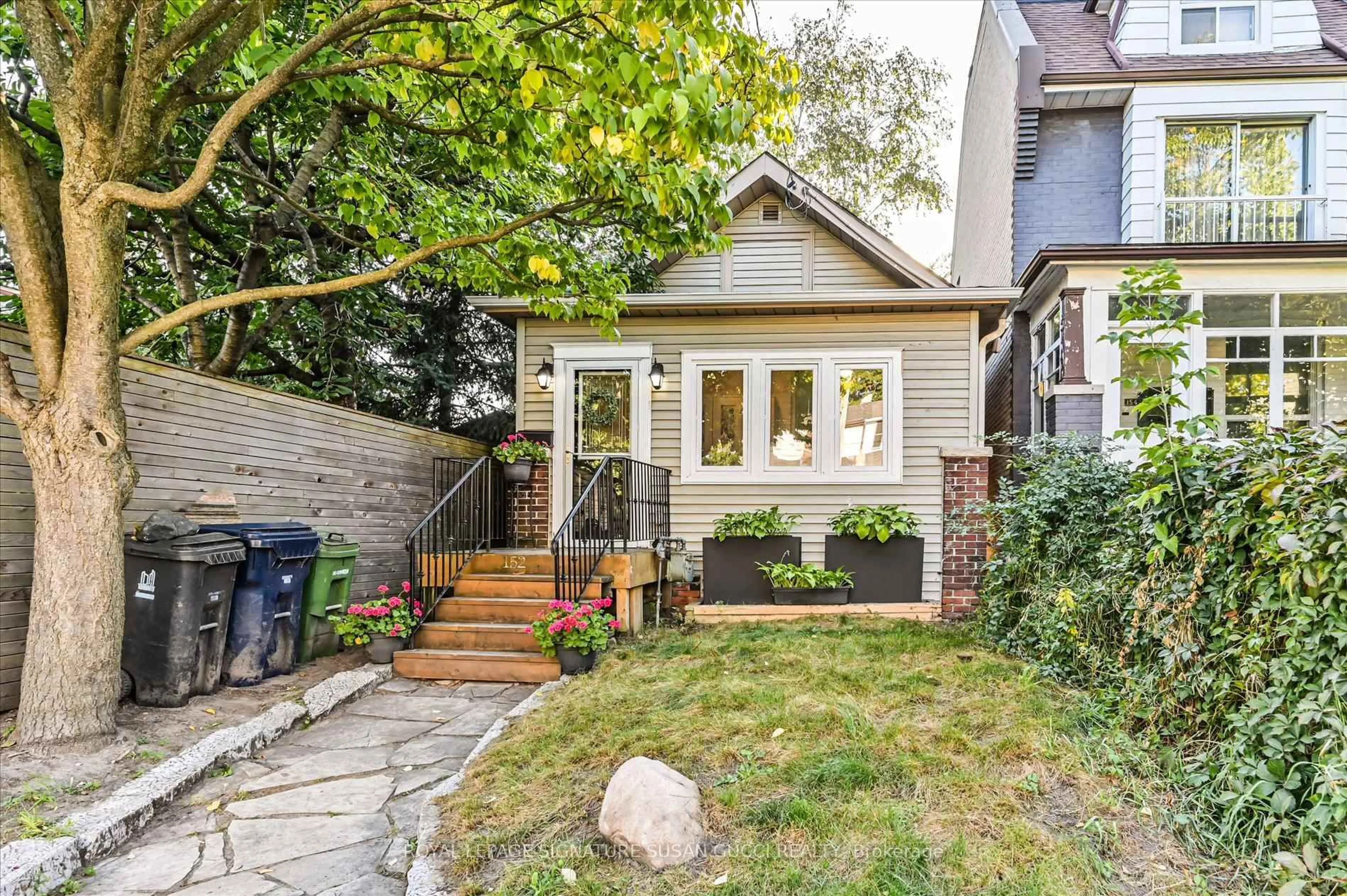 Home with brick exterior material, street for 152 Drayton Ave, Toronto Ontario M4C 3M2