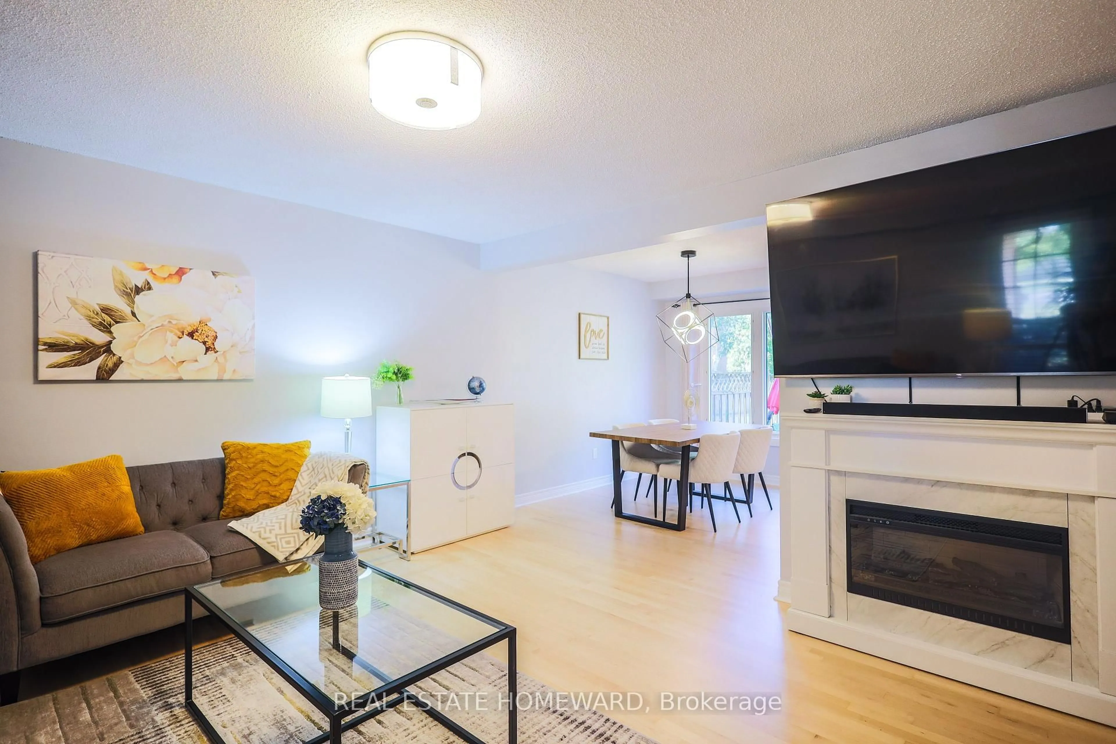 Living room with furniture, wood/laminate floor for 48 Old Colony Dr, Whitby Ontario L1R 2A4