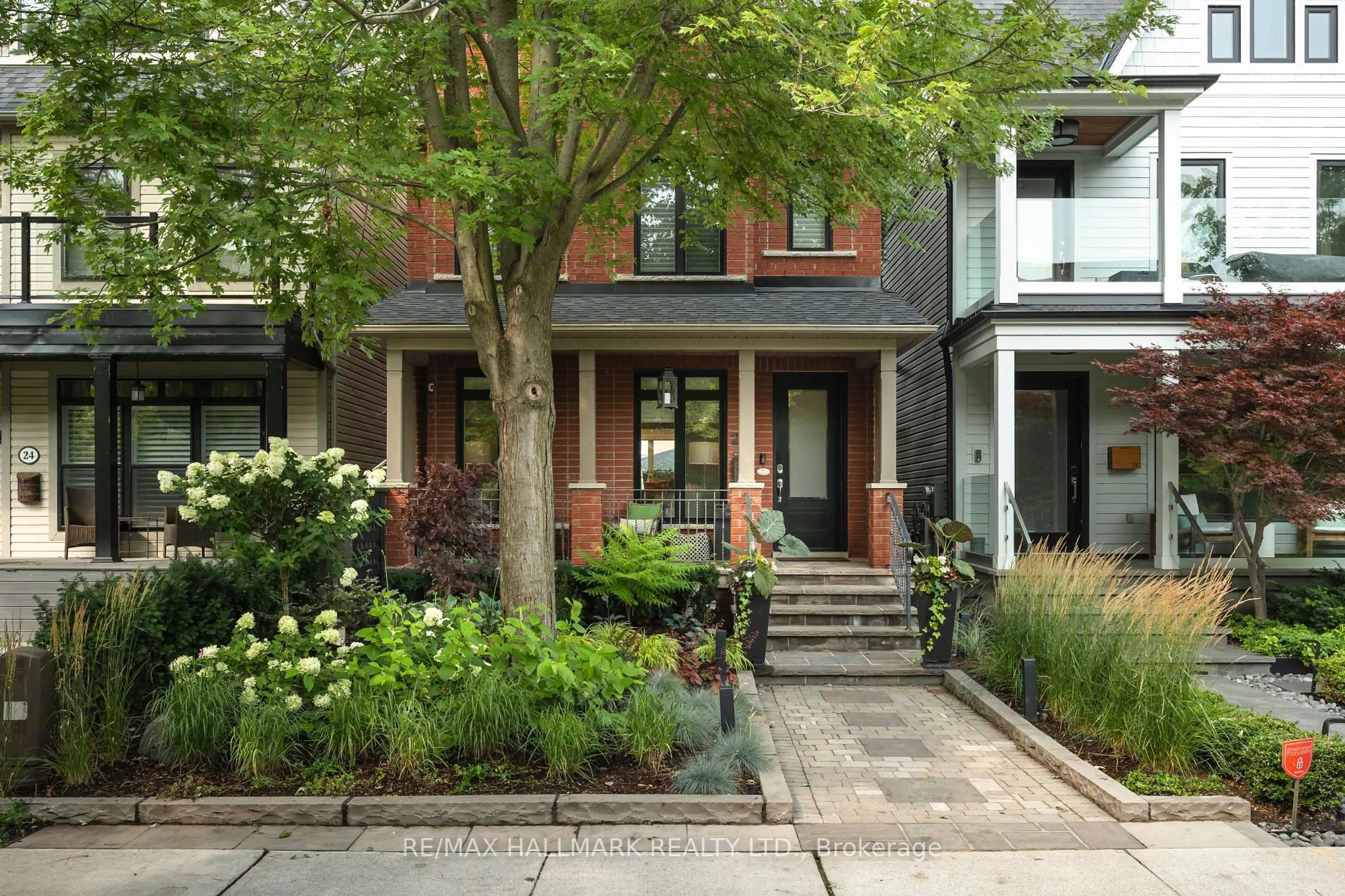 Home with brick exterior material, street for 26 Winners Circ, Toronto Ontario M4L 3Z7