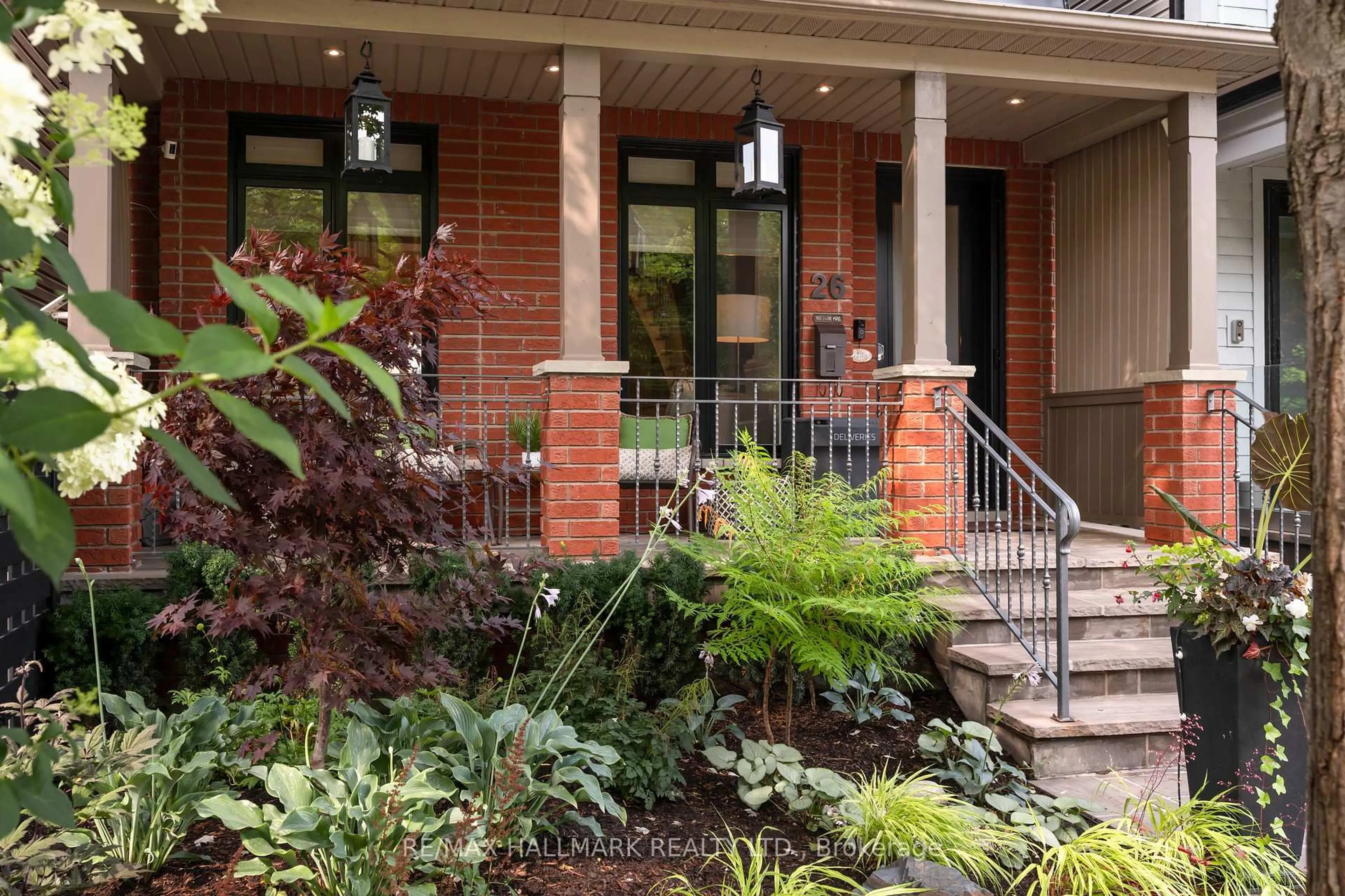 Home with brick exterior material, street for 26 Winners Circ, Toronto Ontario M4L 3Z7