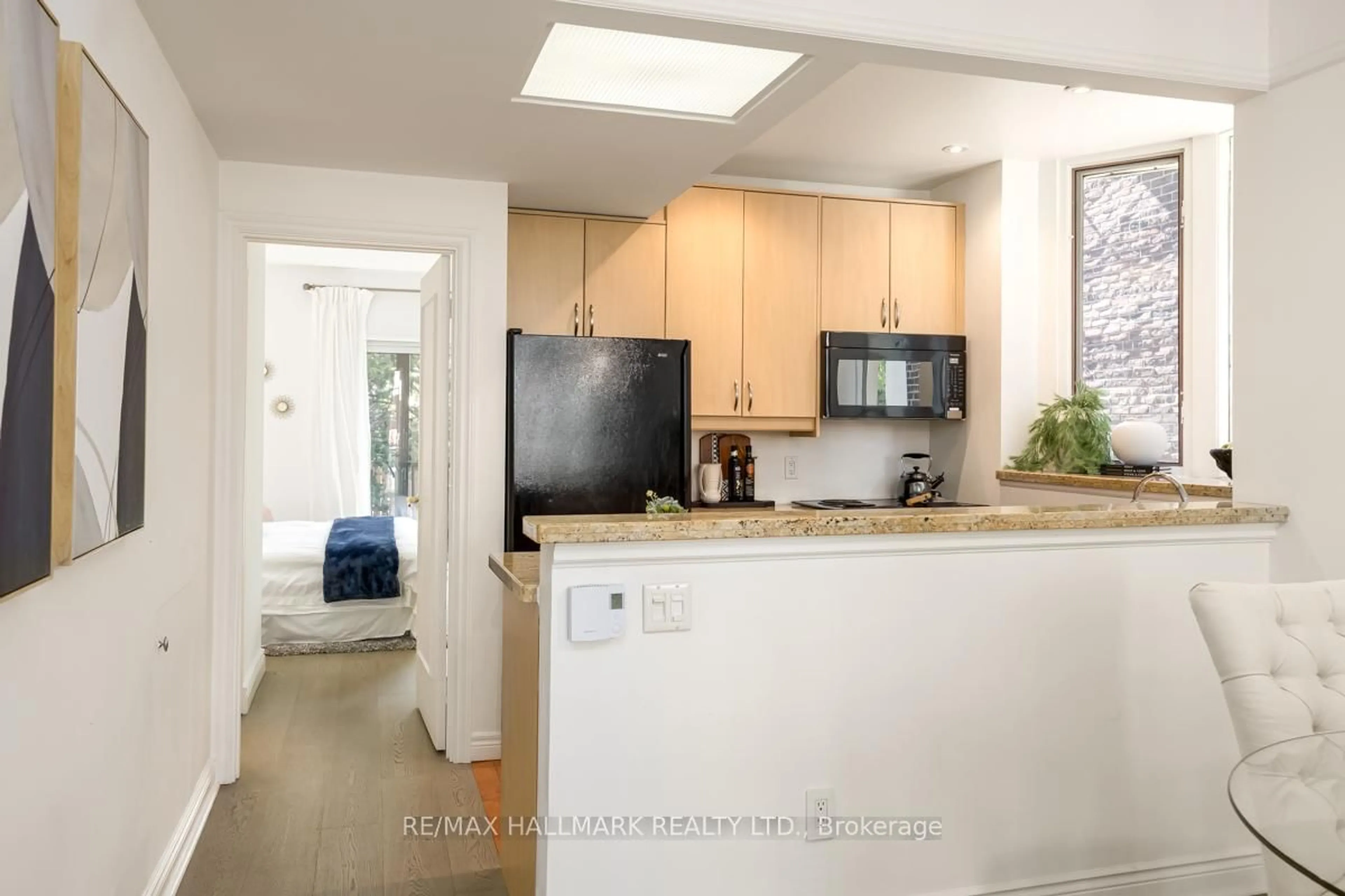 Open concept kitchen, ceramic/tile floor for 49 Harcourt Ave, Toronto Ontario M4J 1J3