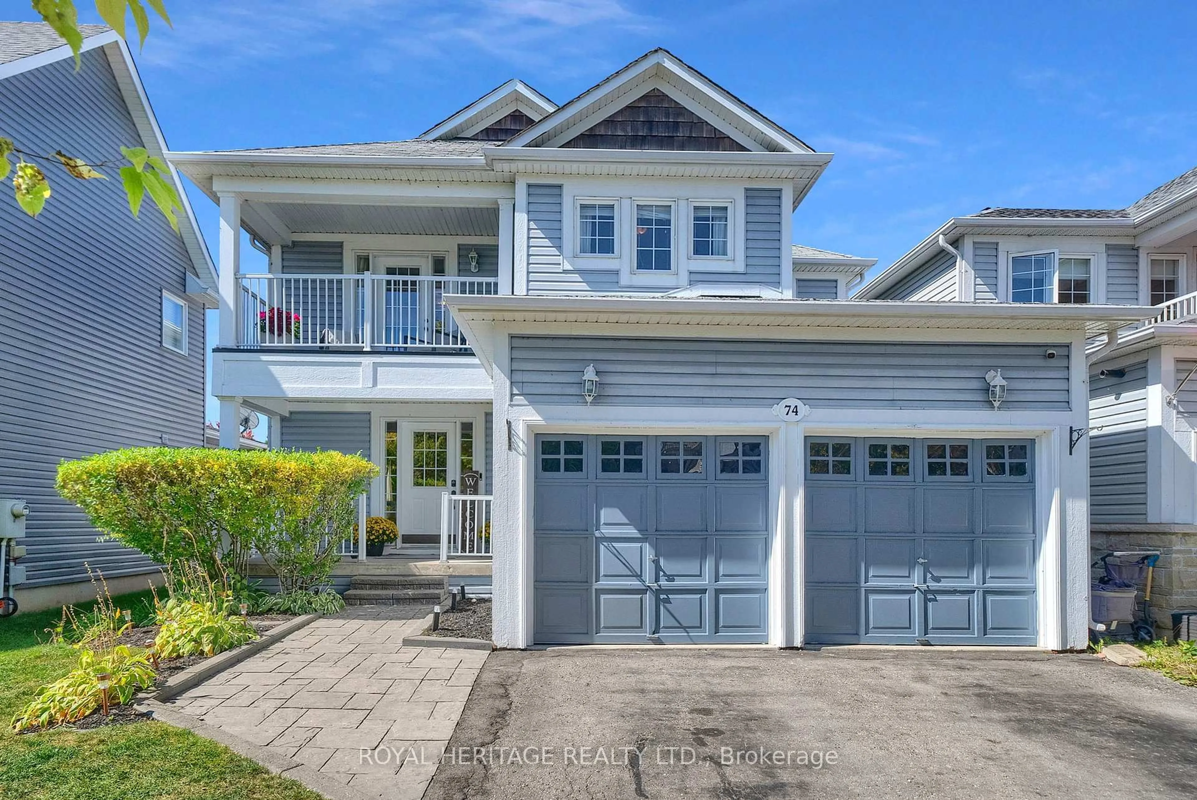 Home with vinyl exterior material, street for 74 Stillwell Lane, Clarington Ontario L1B 1R4