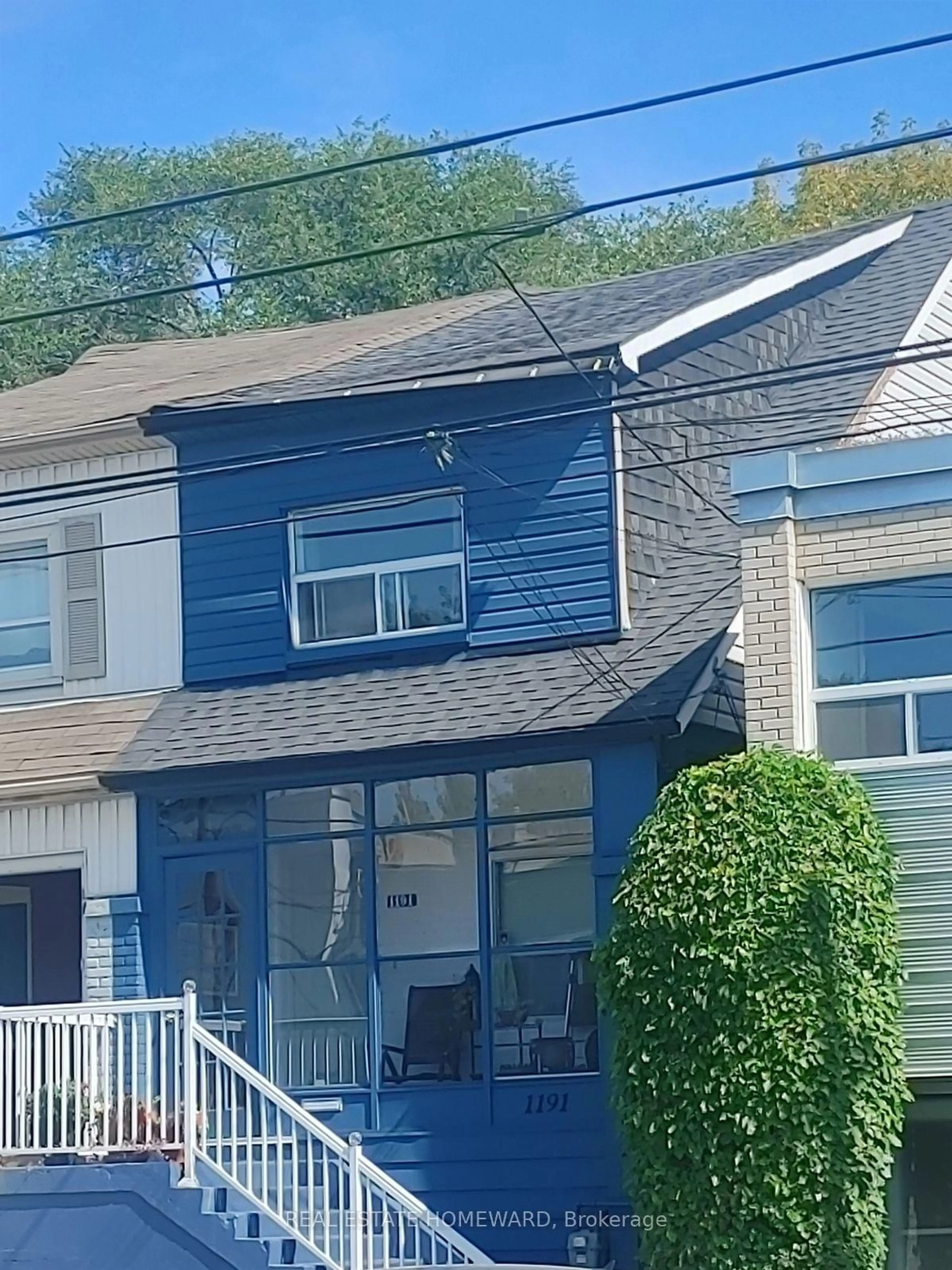 Home with vinyl exterior material, street for 1191 Woodbine Ave, Toronto Ontario M4C 4E1
