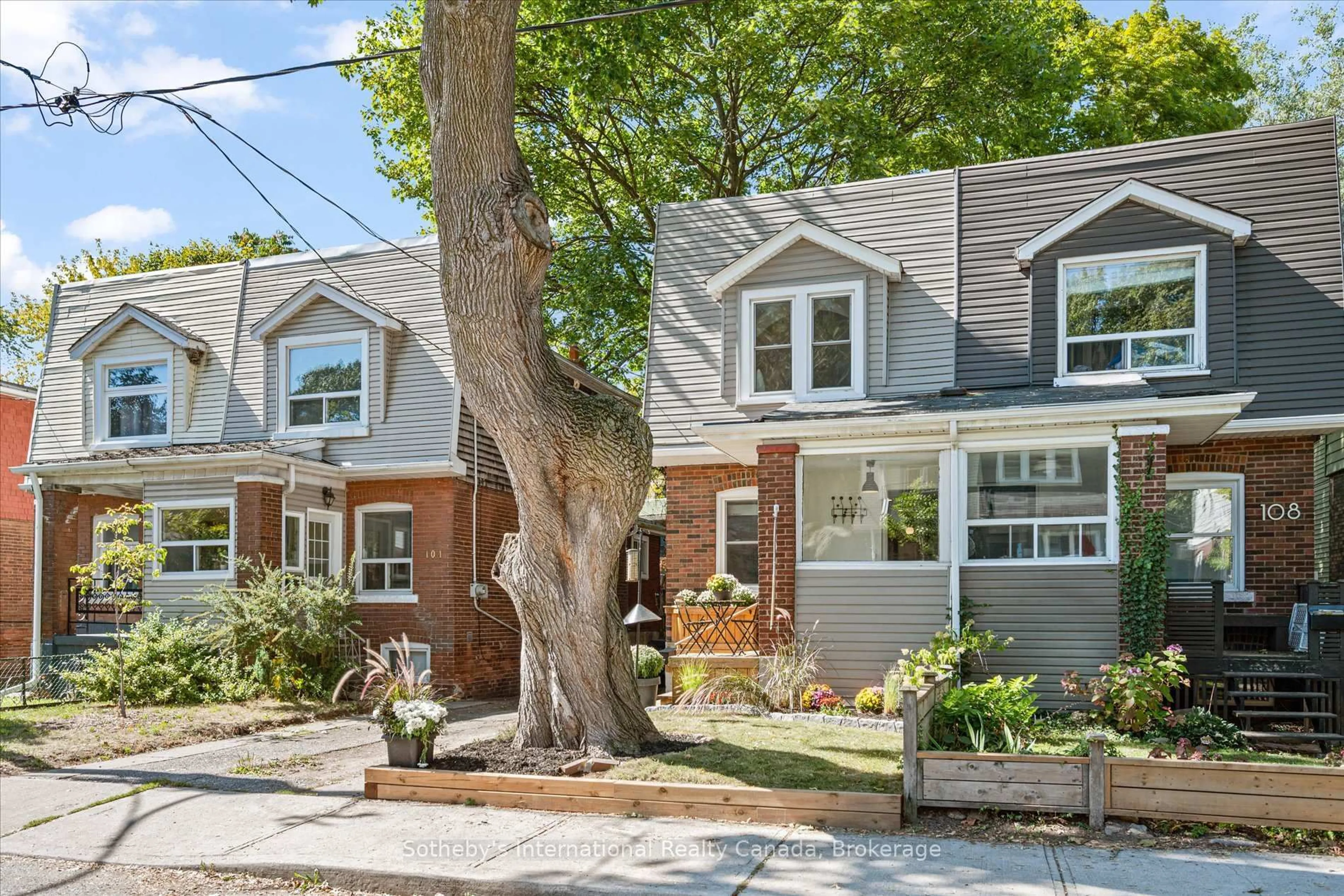 Home with brick exterior material, street for 106 Hiltz Ave, Toronto Ontario M4L 2N5
