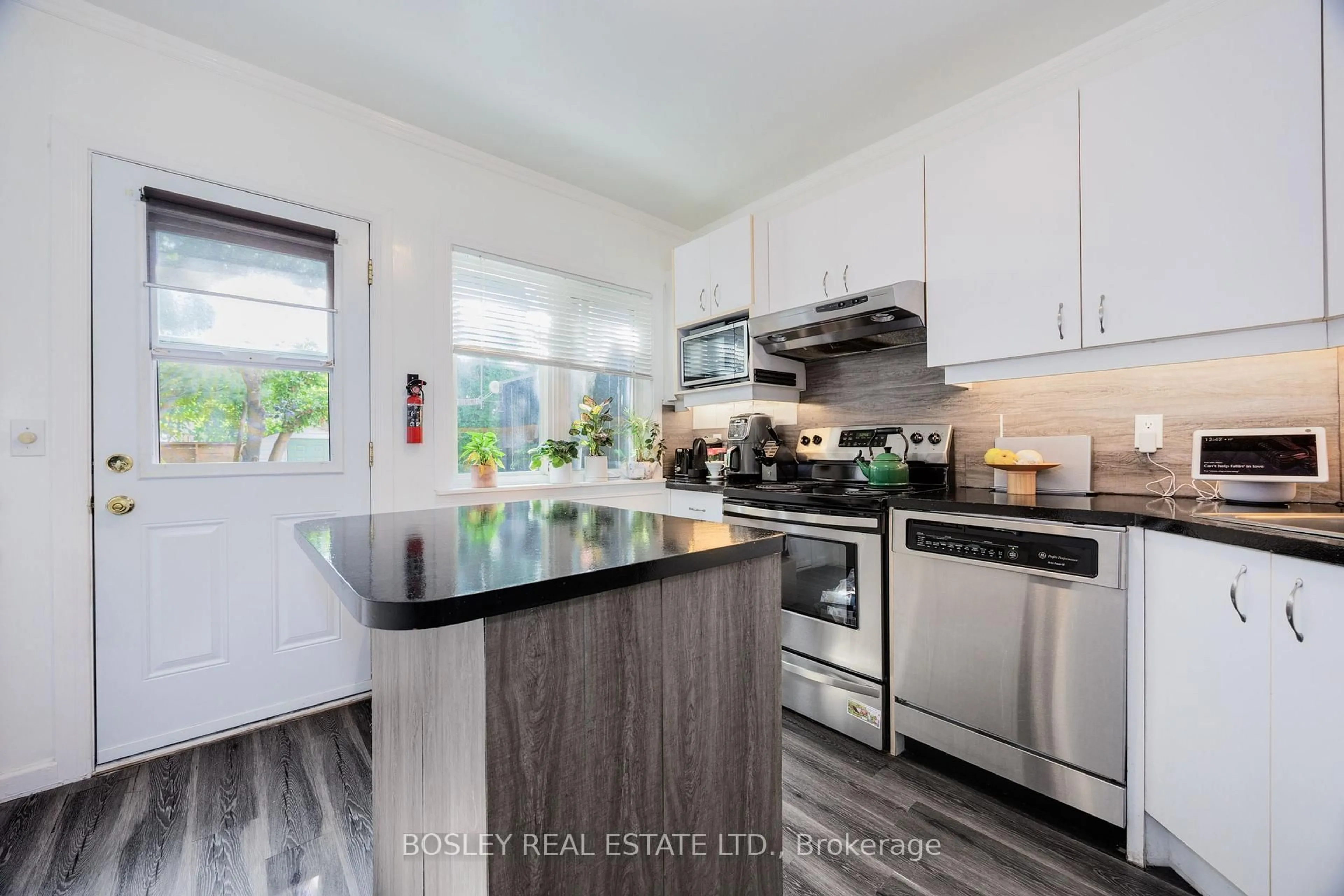 Open concept kitchen, wood/laminate floor for 203 Virginia Ave, Toronto Ontario M4C 2T6