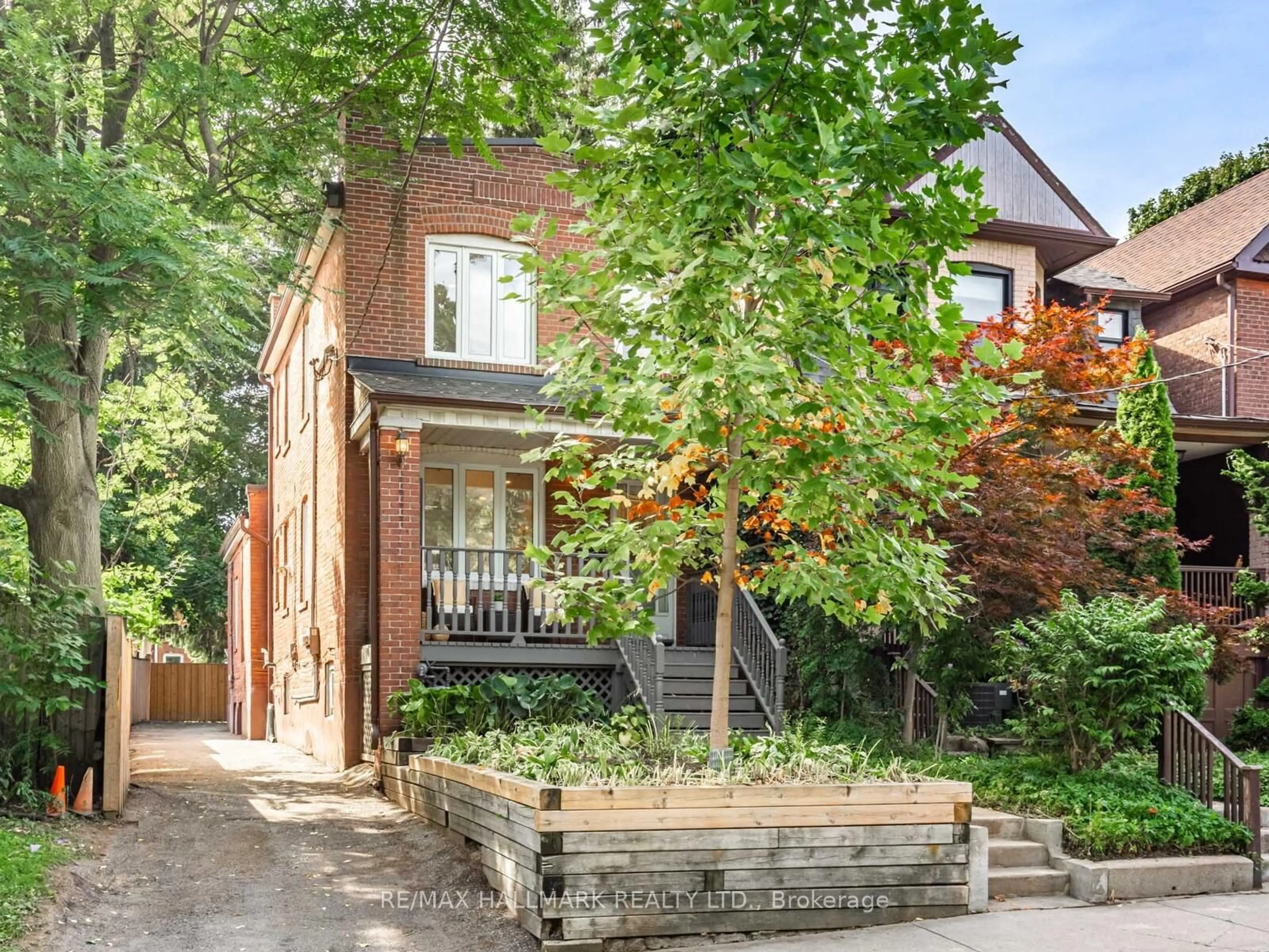 Home with brick exterior material, street for 8 Redwood Ave, Toronto Ontario M4L 2S6