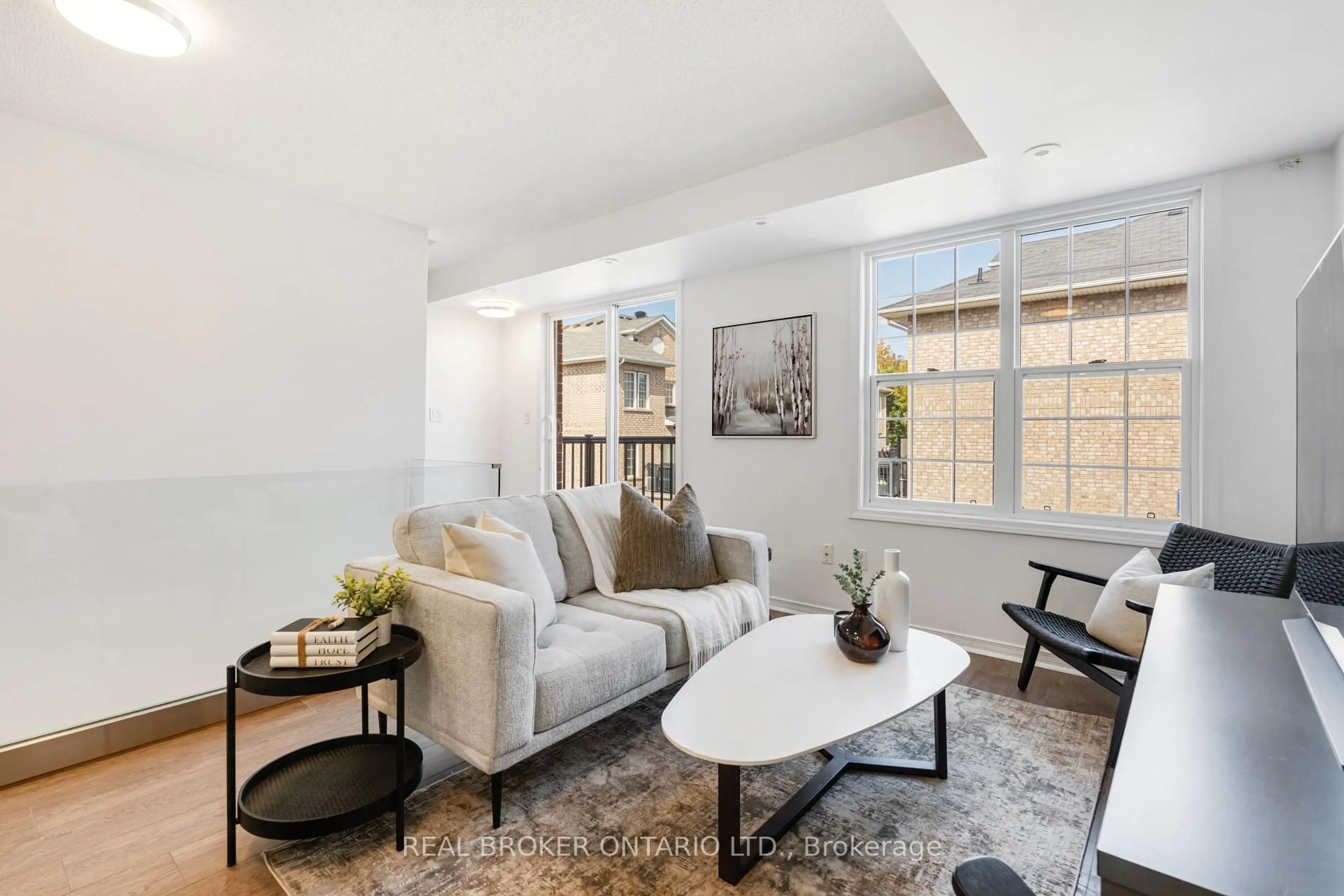 Living room with furniture, unknown for 35 Strangford Lane #301, Toronto Ontario M1L 0E5