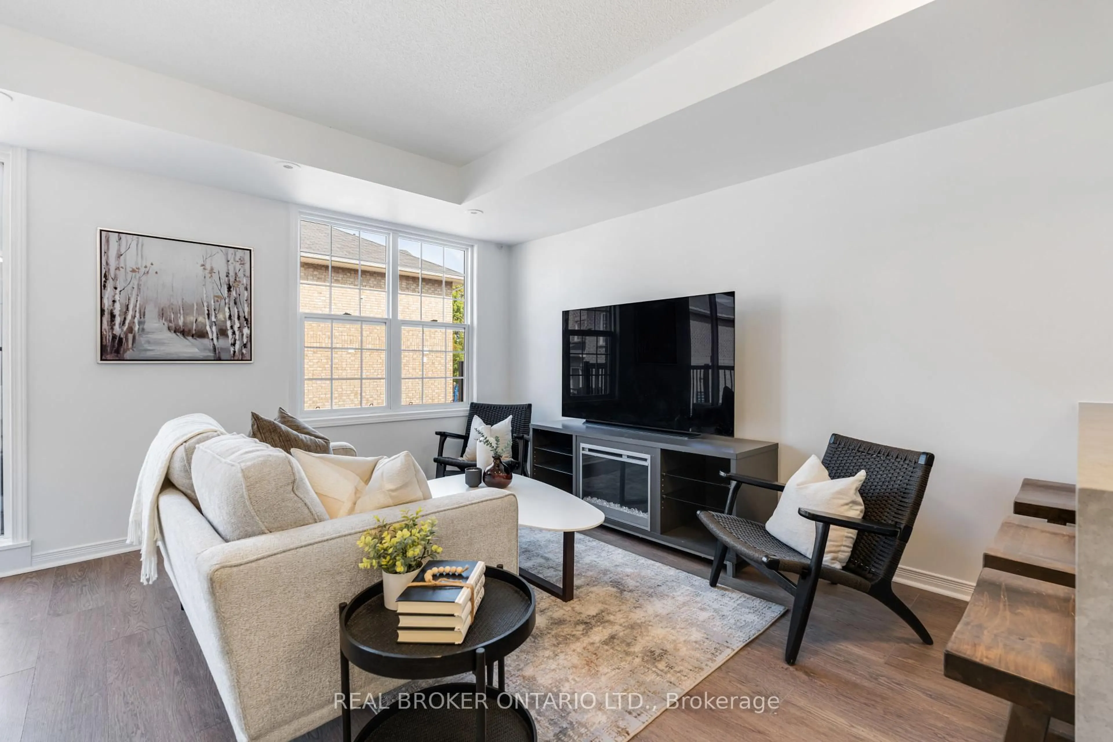 Living room with furniture, unknown for 35 Strangford Lane #301, Toronto Ontario M1L 0E5