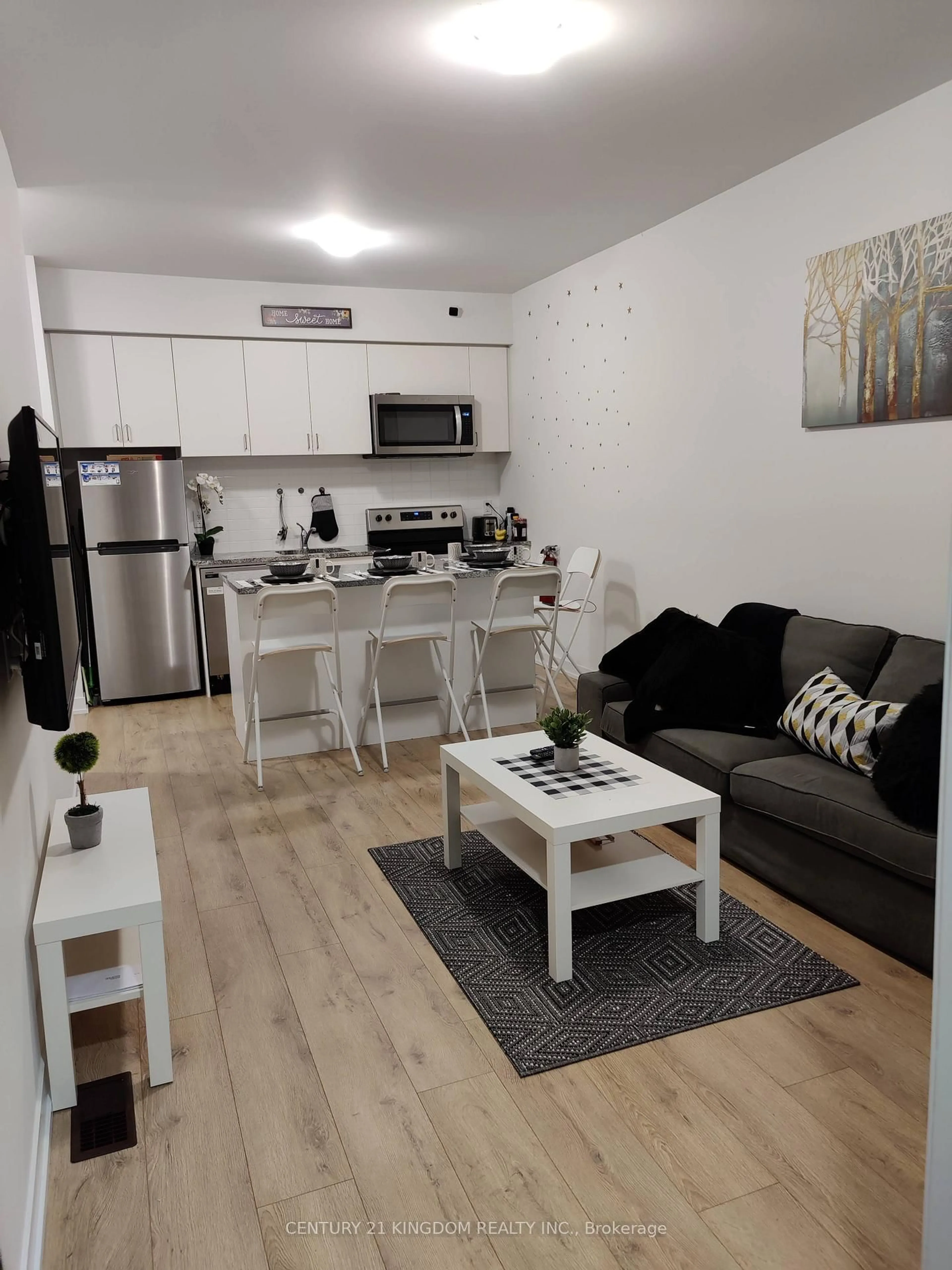 Living room with furniture, wood/laminate floor for 1740 Simcoe St #37, Oshawa Ontario L1G 4X9