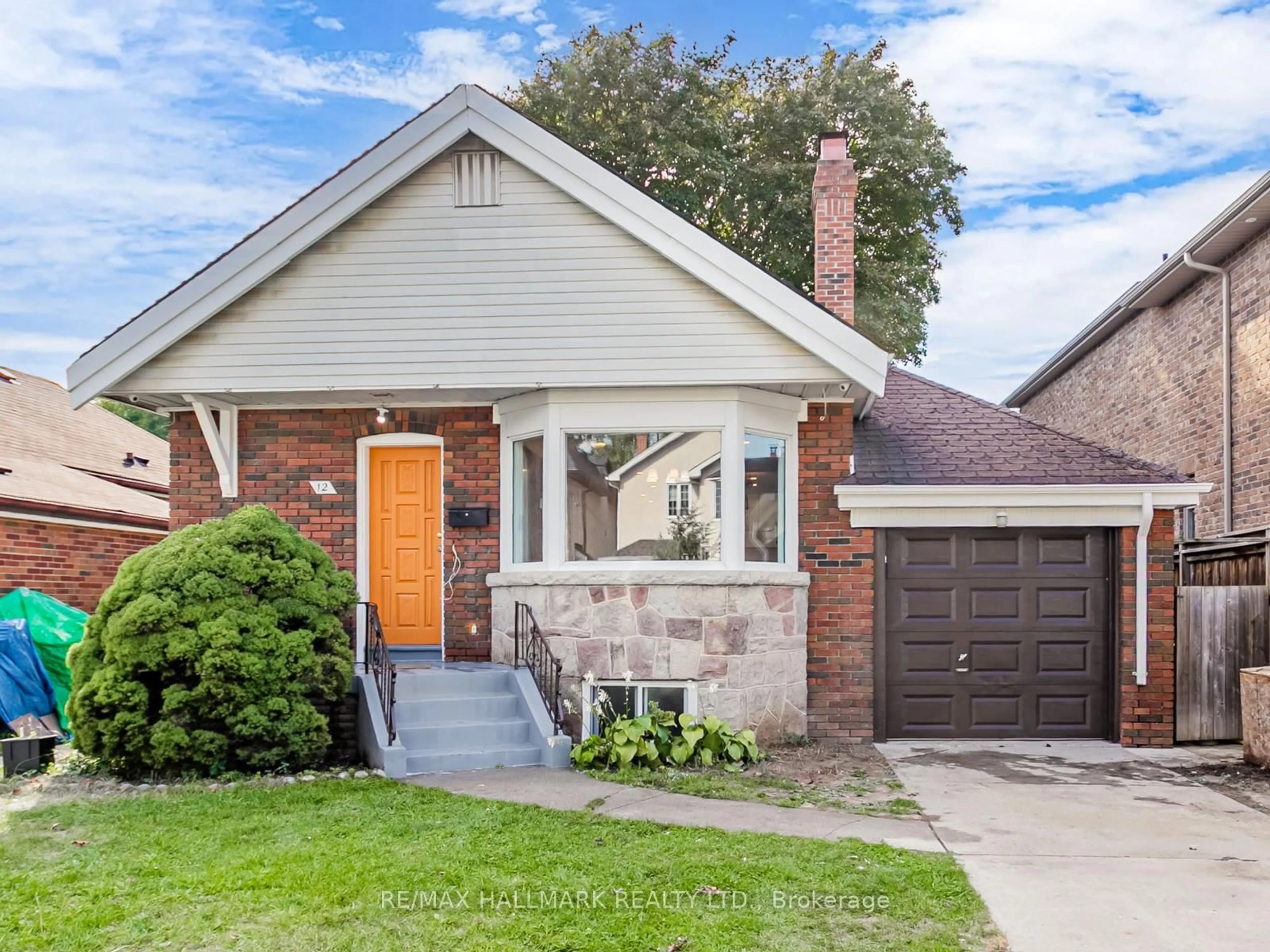 Home with brick exterior material, street for 12 Ralston Ave, Toronto Ontario M4C 3L5