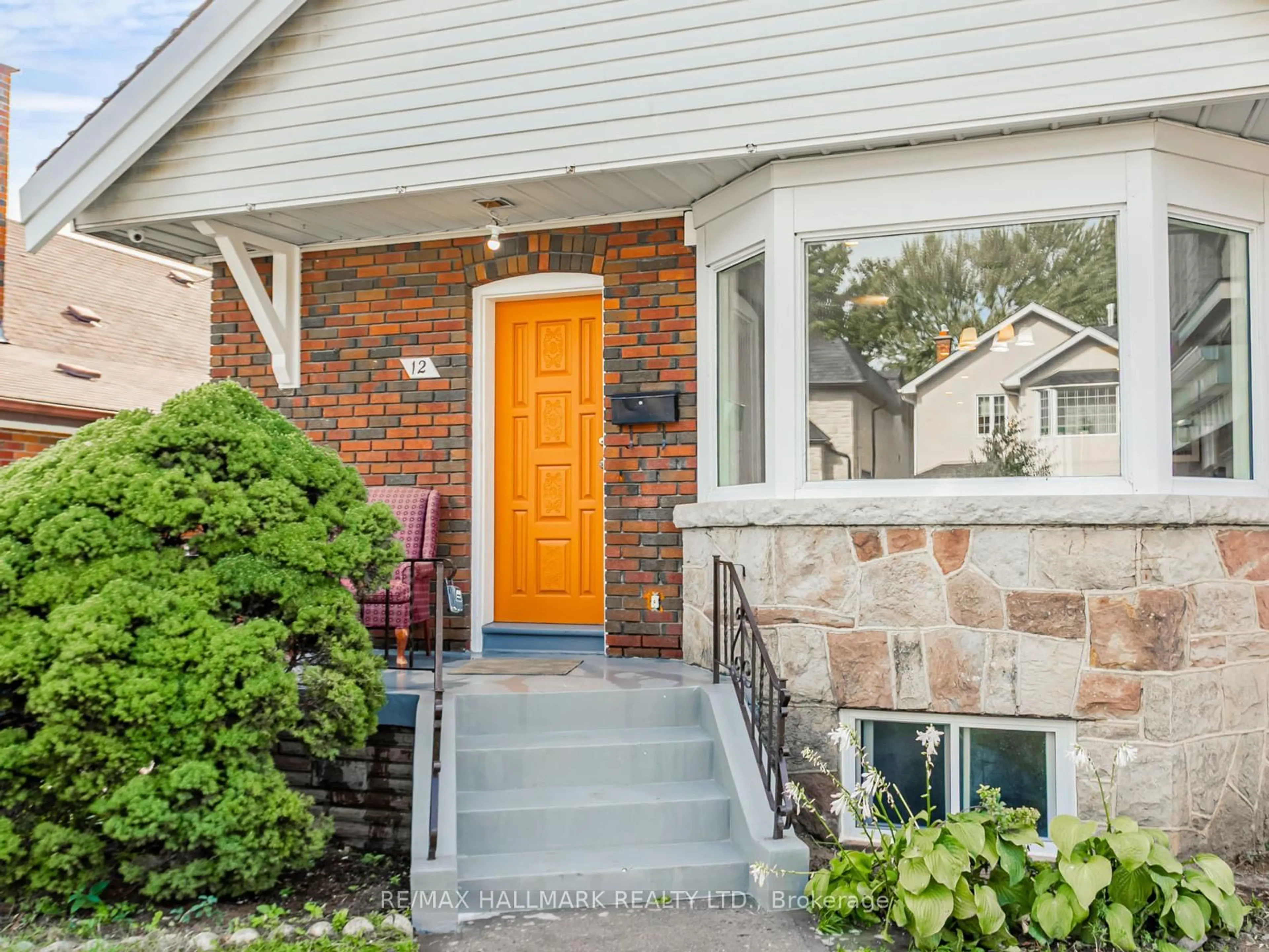 Home with brick exterior material, street for 12 Ralston Ave, Toronto Ontario M4C 3L5