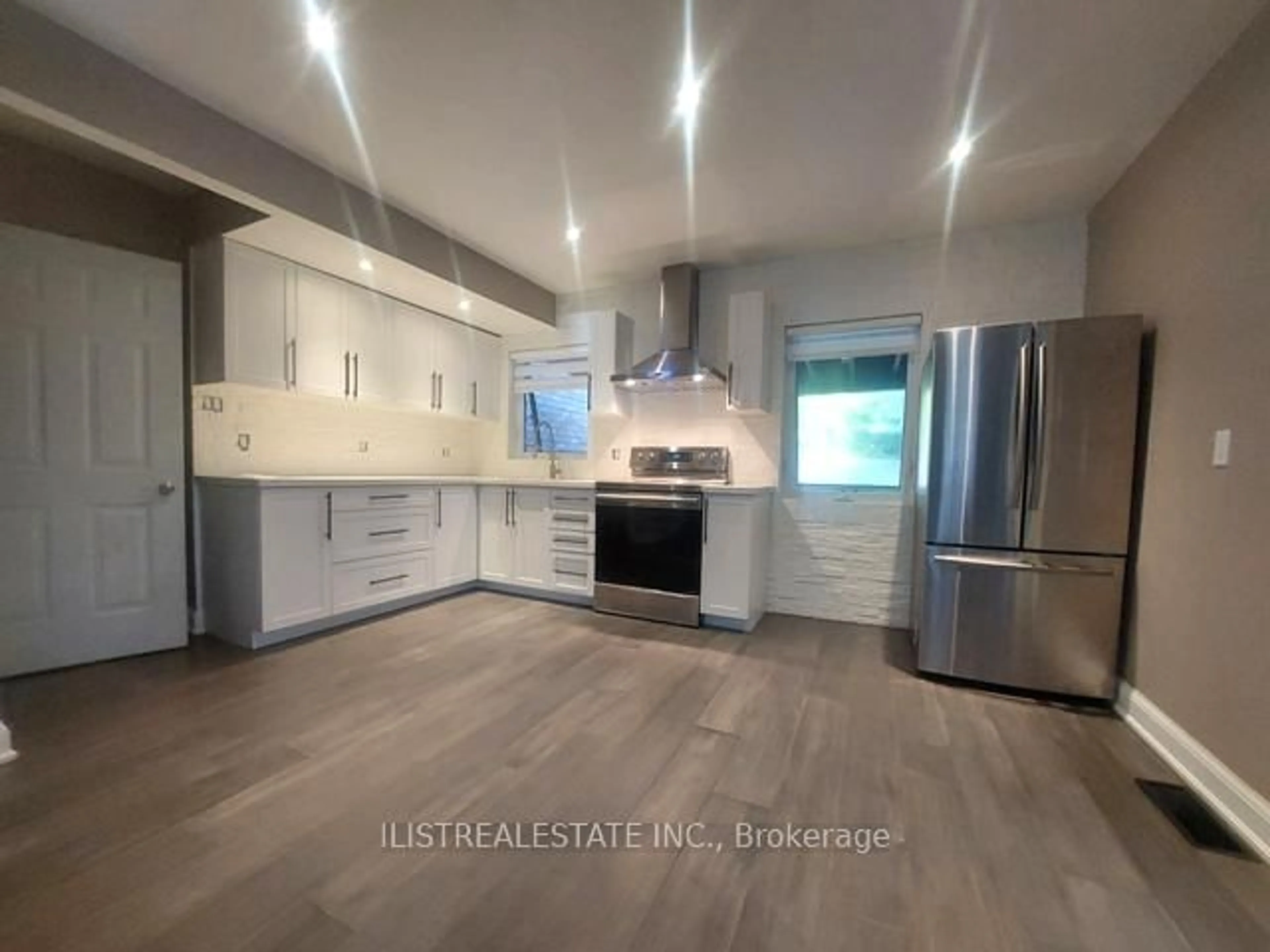 Open concept kitchen, wood/laminate floor for 43 Anaconda Ave, Toronto Ontario M1L 4M1