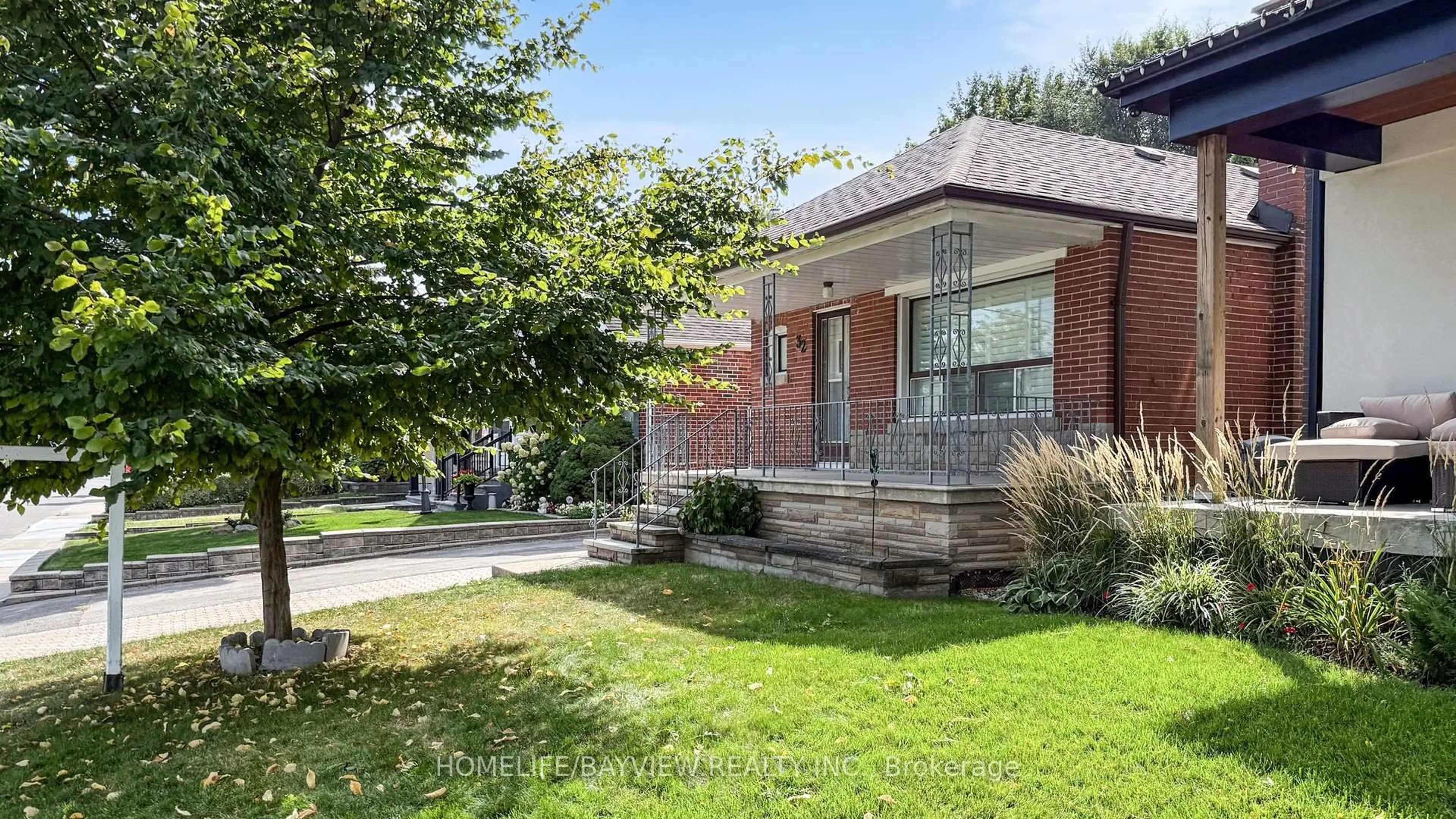 Home with brick exterior material, street for 32 Denvale Rd, Toronto Ontario M4B 3B5