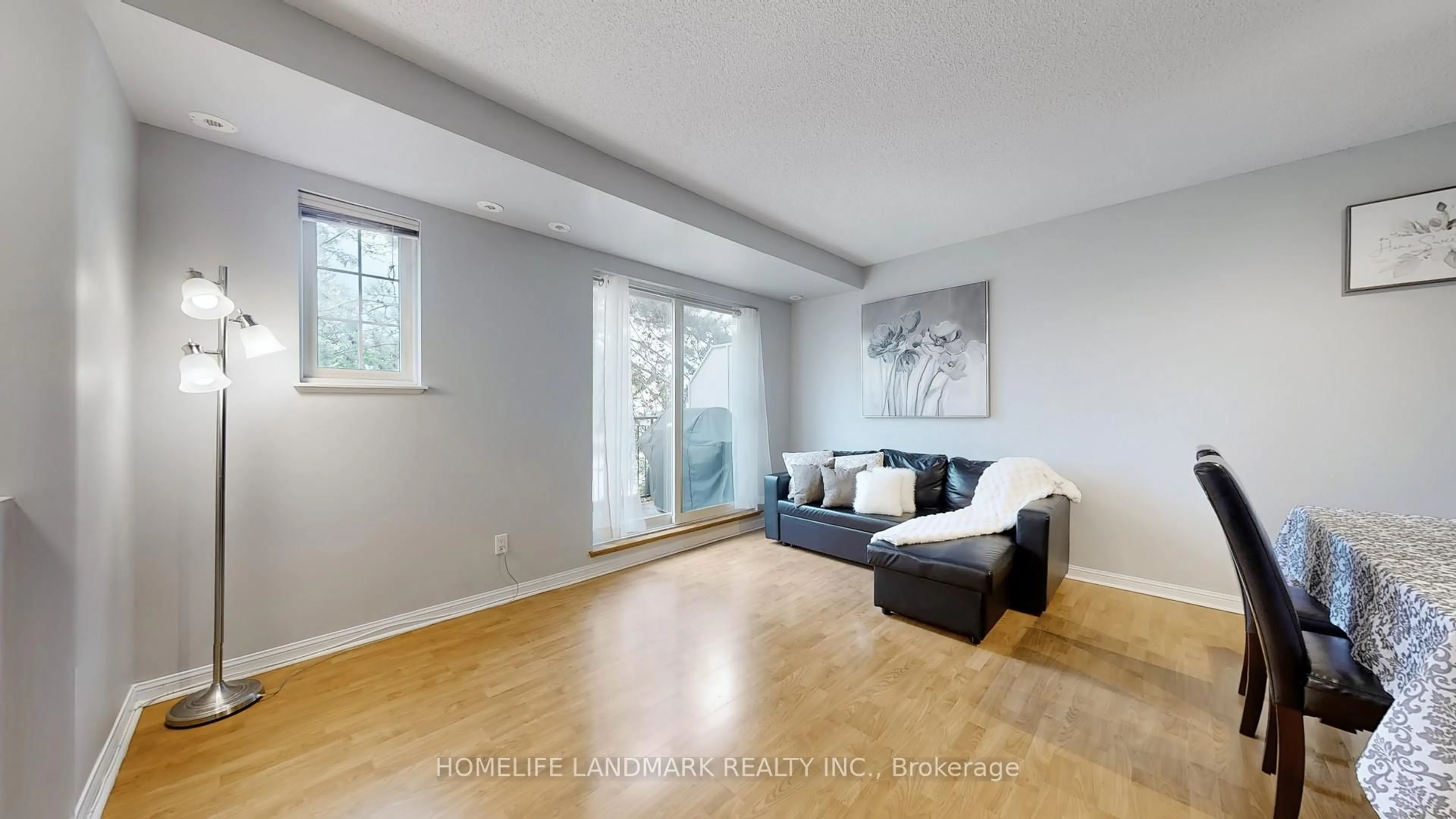 Living room with furniture, wood/laminate floor for 1881 Mcnicoll Ave #227, Toronto Ontario M1V 5M2