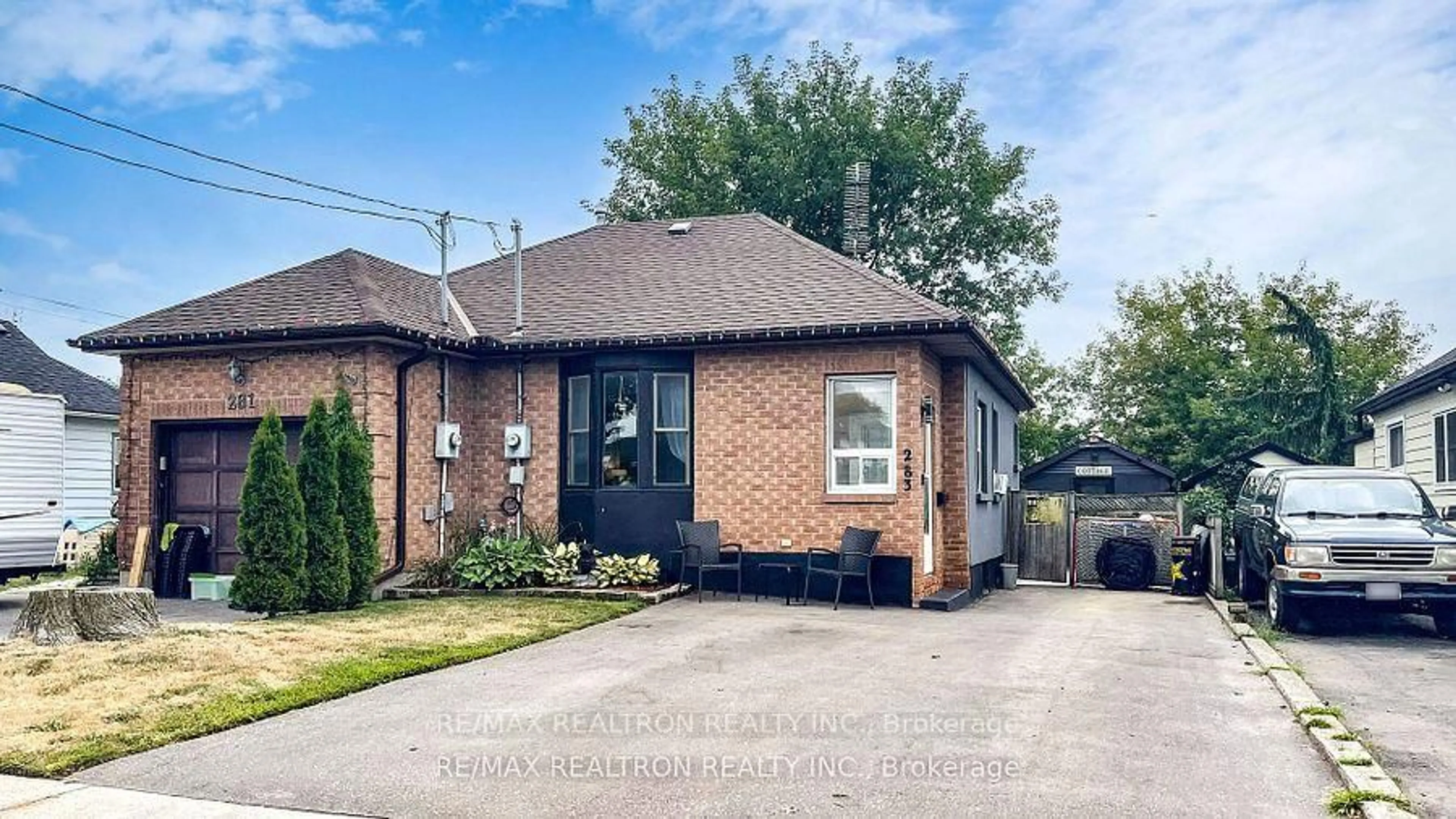Home with brick exterior material, street for 283 College Ave, Oshawa Ontario L1J 1R9