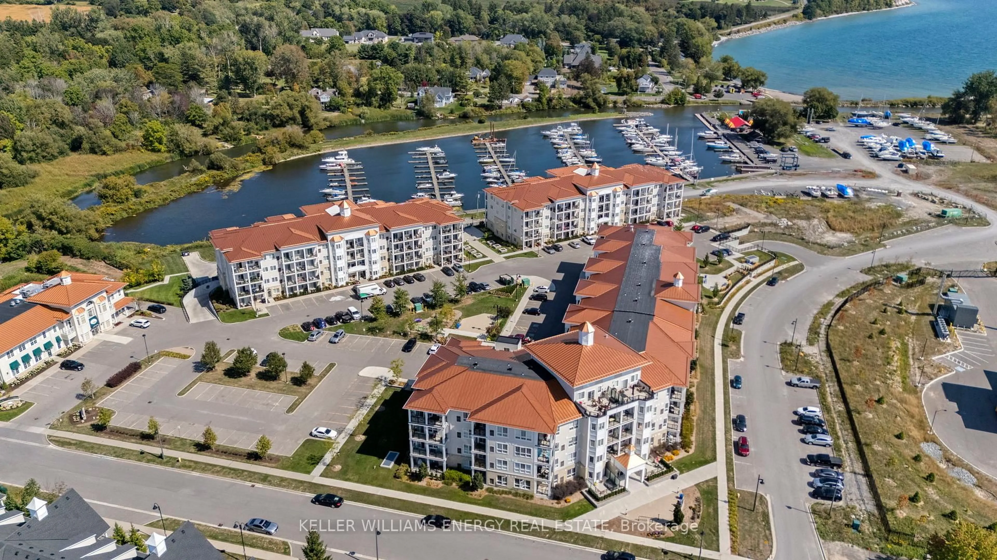 A pic from outside/outdoor area/front of a property/back of a property/a pic from drone, water/lake/river/ocean view for 50 Lakebreeze Dr #106, Clarington Ontario L1B 0V9