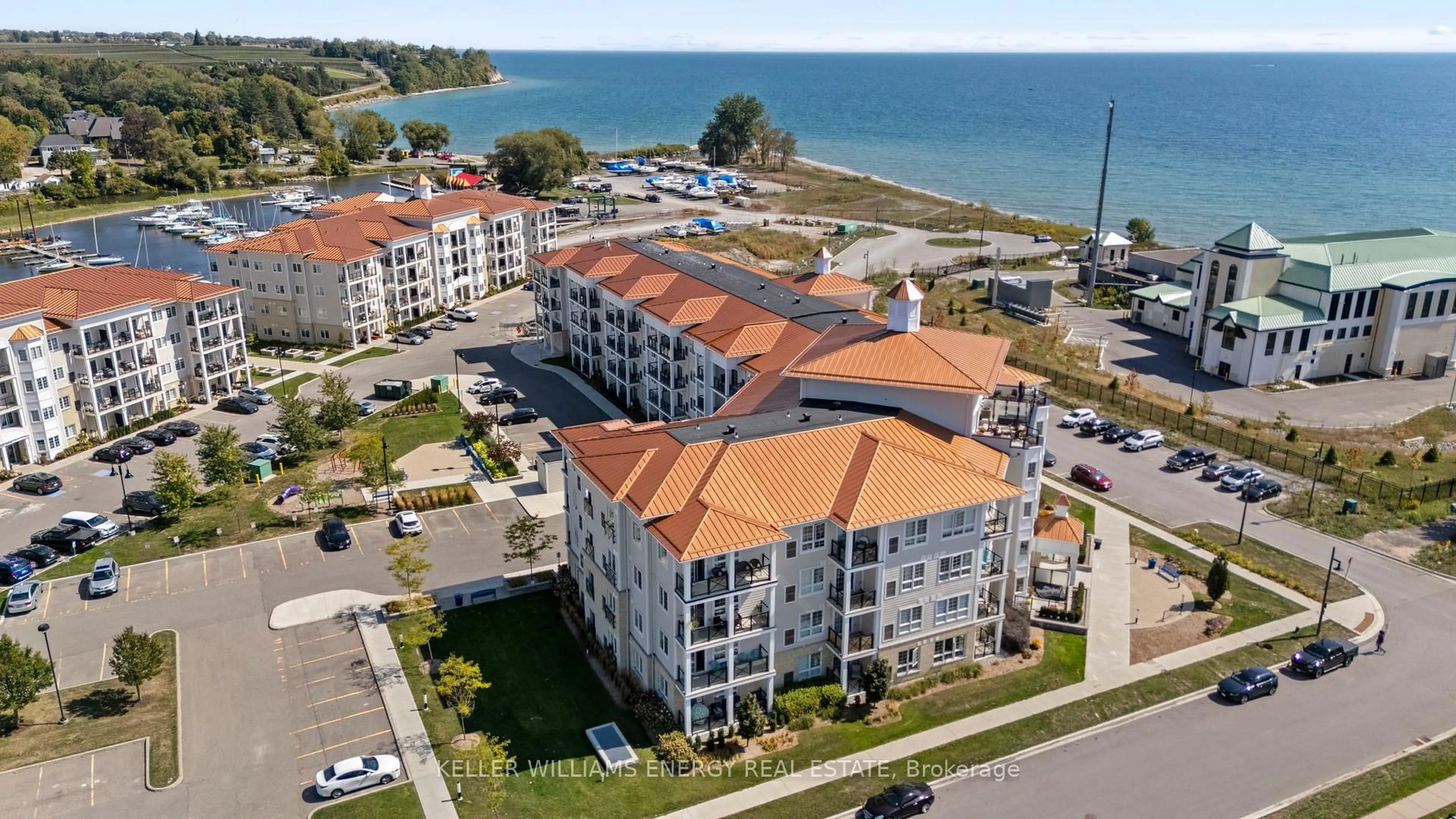 A pic from outside/outdoor area/front of a property/back of a property/a pic from drone, water/lake/river/ocean view for 50 Lakebreeze Dr #106, Clarington Ontario L1B 0V9