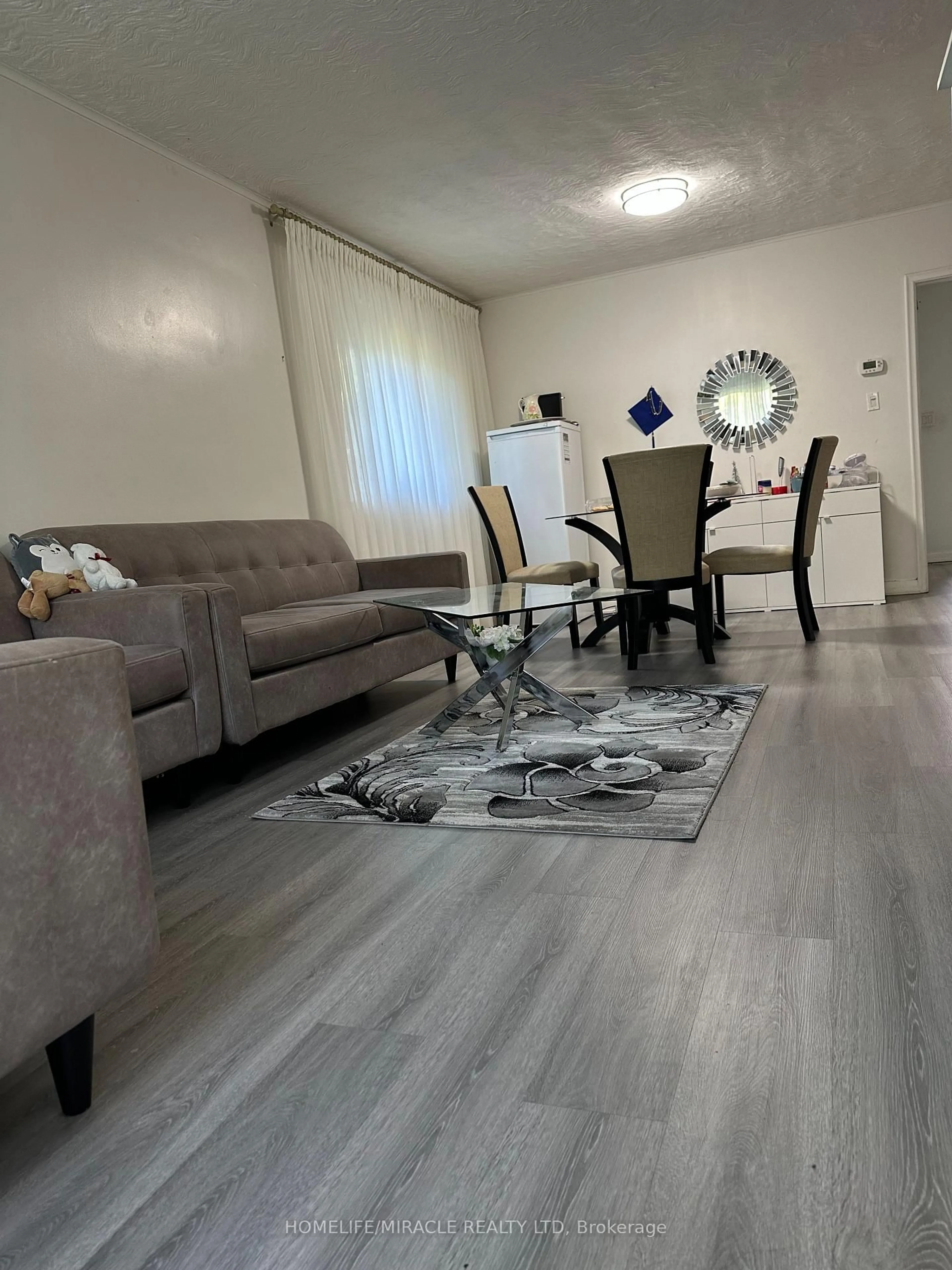 Living room with furniture, unknown for 140 Porchester Dr, Toronto Ontario M1J 2R7