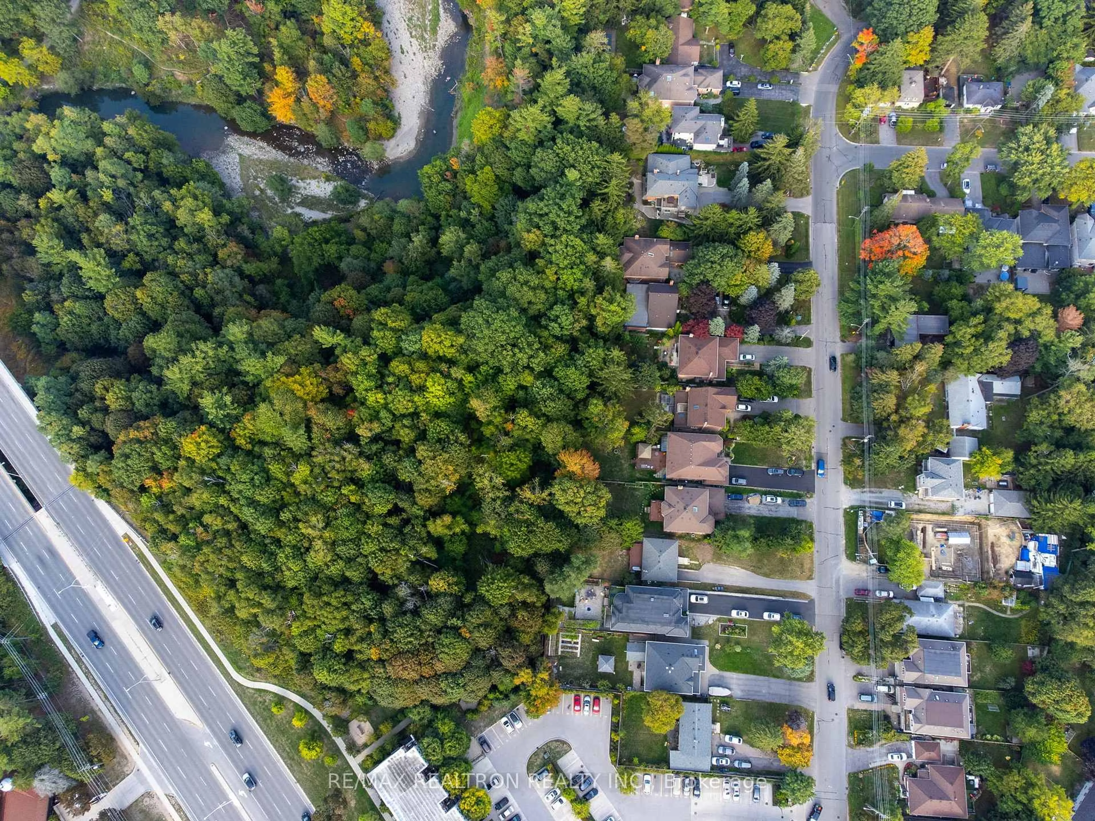 A pic from outside/outdoor area/front of a property/back of a property/a pic from drone, forest/trees view for 371 Beechgrove Dr, Toronto Ontario M1E 4A2