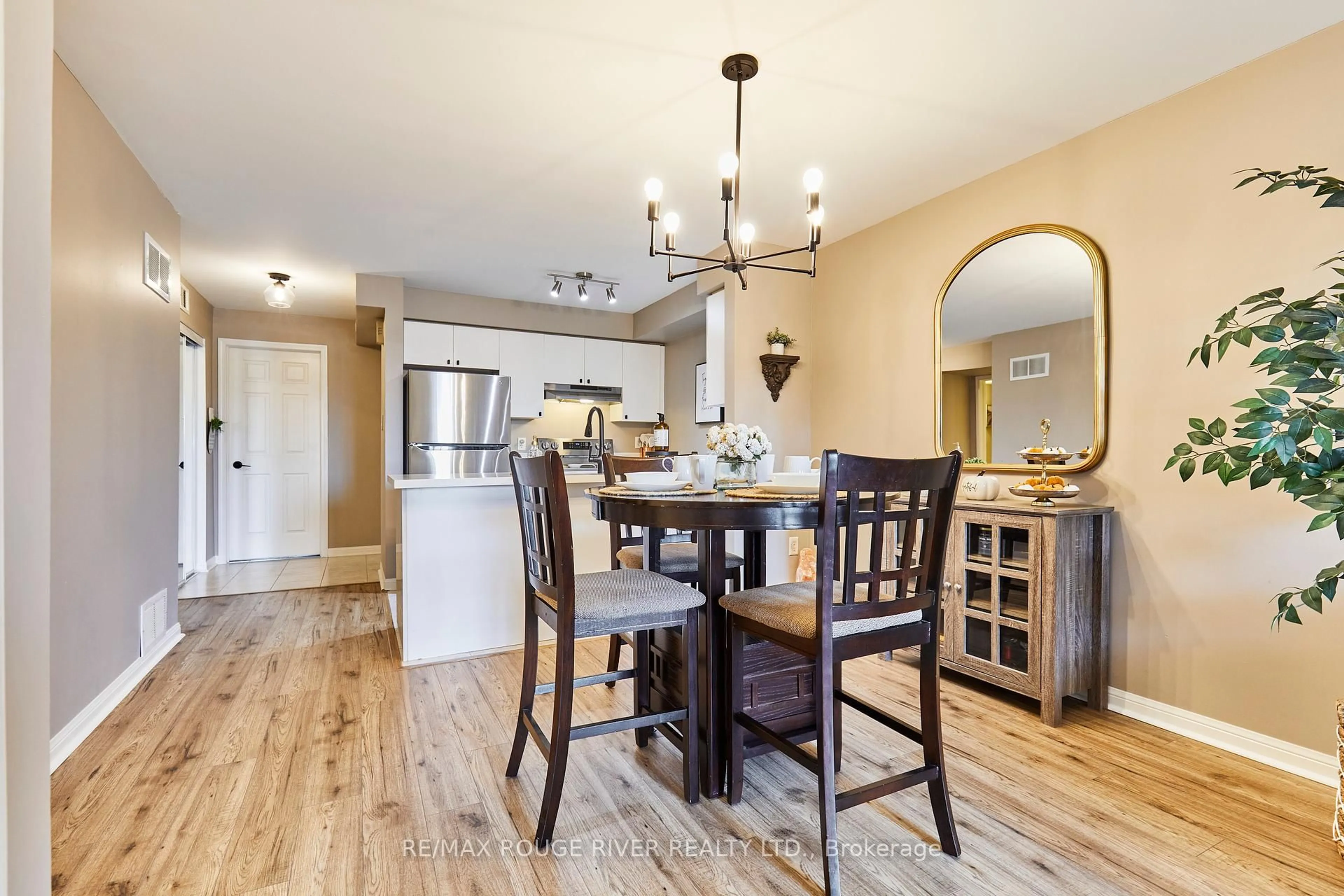 Open concept kitchen, wood/laminate floor for 72 Petra Way #2, Whitby Ontario L1R 0A3