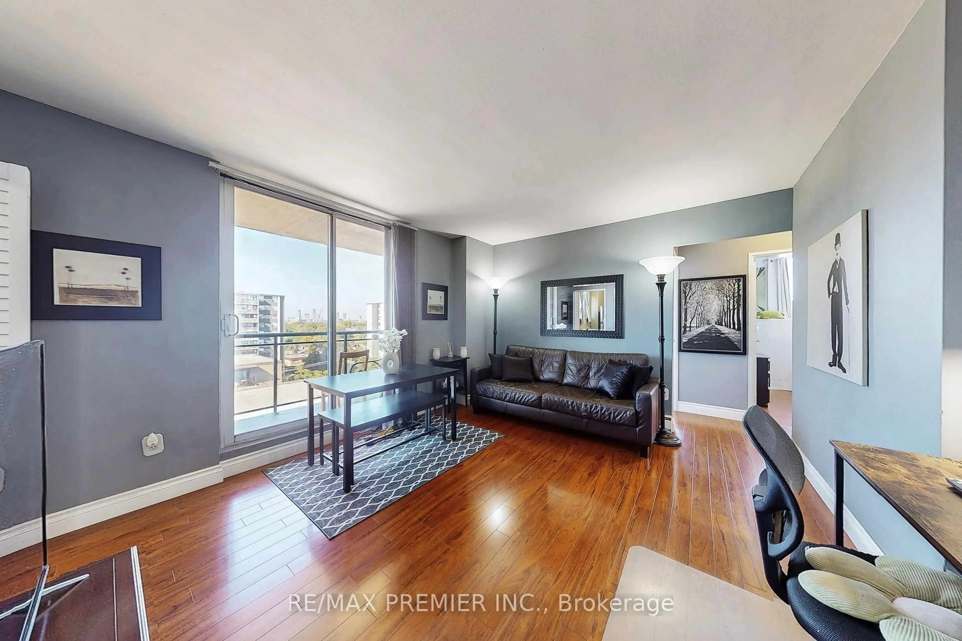 Living room with furniture, wood/laminate floor for 1145 Logan Ave #1001, Toronto Ontario M4K 3G9