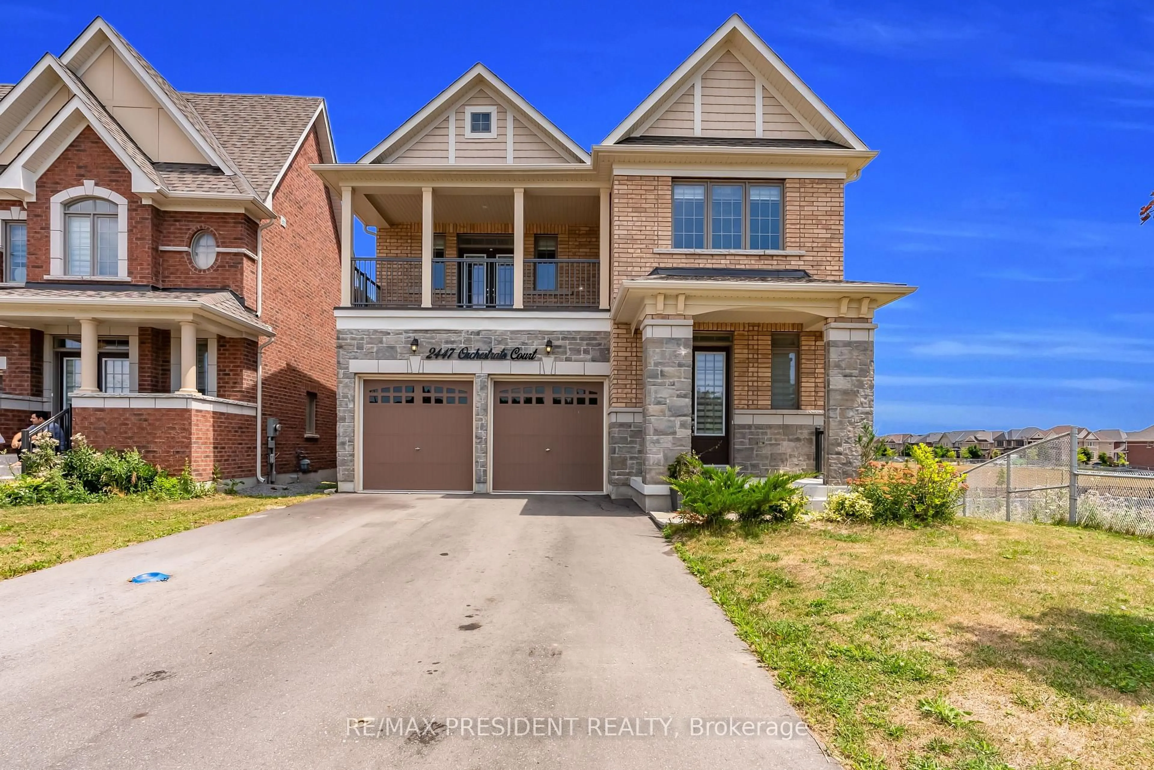 Home with brick exterior material, street for 2447 Orchestrate Crt, Oshawa Ontario L1L 0R3