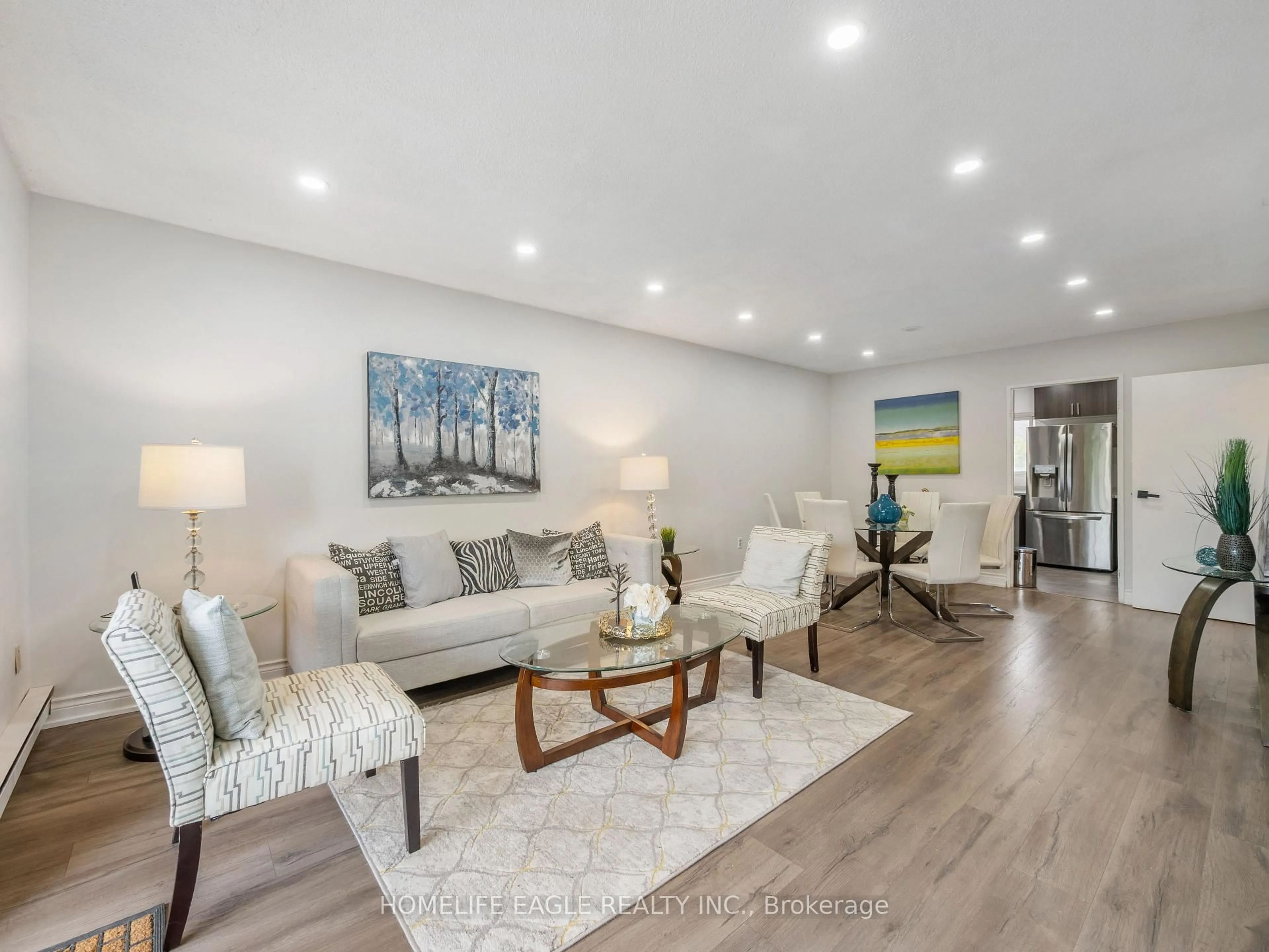 Living room with furniture, wood/laminate floor for 50 Scarborough Golf Club Rd #118, Toronto Ontario M1M 3T5