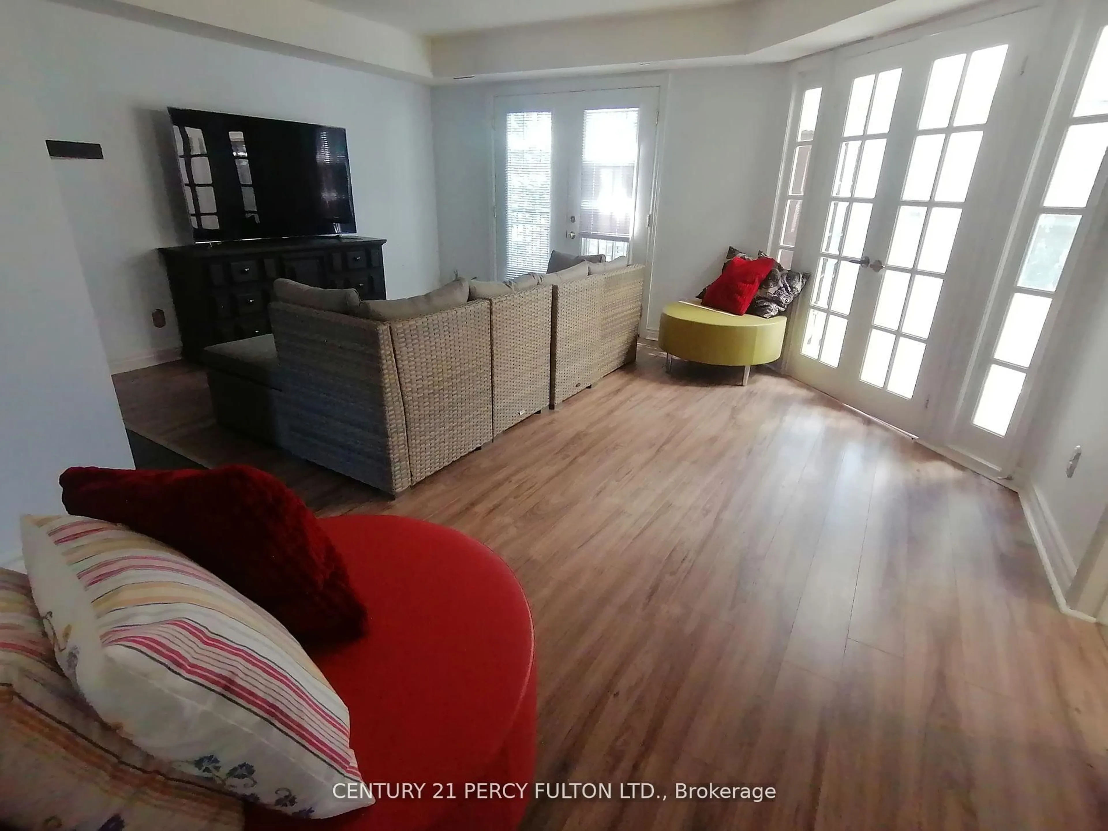 Living room with furniture, wood/laminate floor for 1651 Nash Rd #A11, Clarington Ontario L1E 1S8