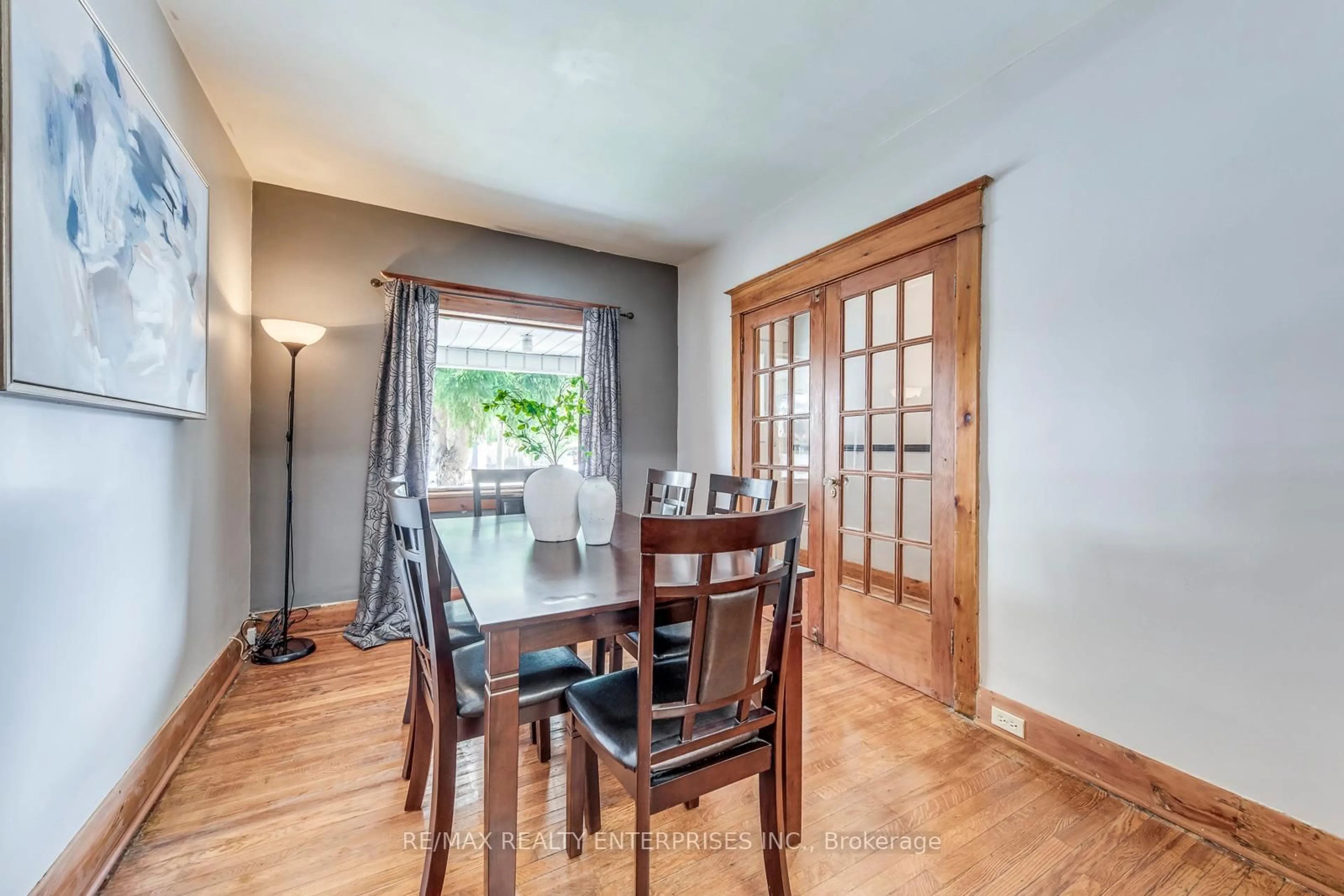 Dining room, wood/laminate floor for 370 Coxwell Ave, Toronto Ontario M4L 3B7