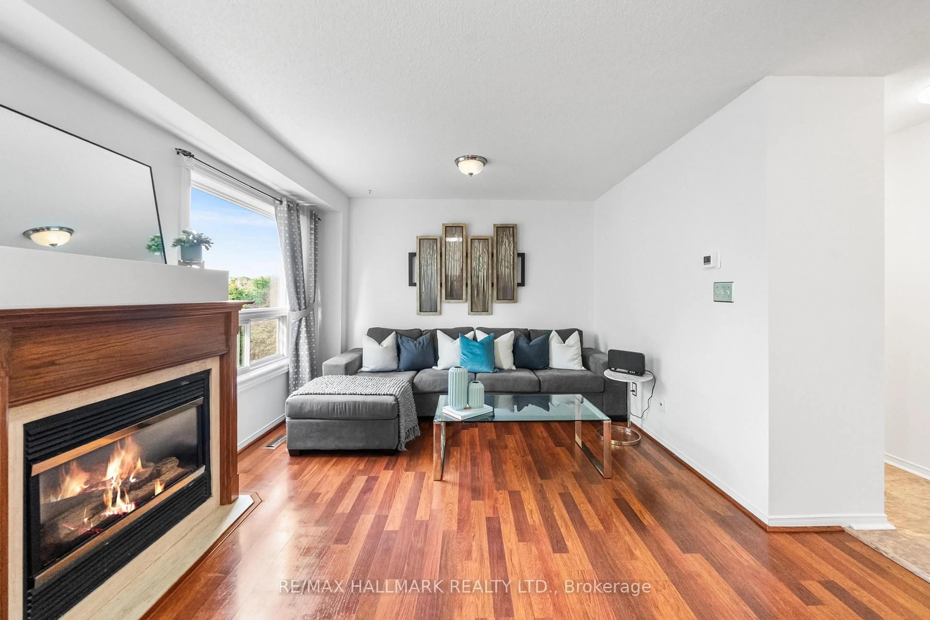 Living room with furniture, wood/laminate floor for 1867 Kingston Rd #18, Pickering Ontario L1V 1C9