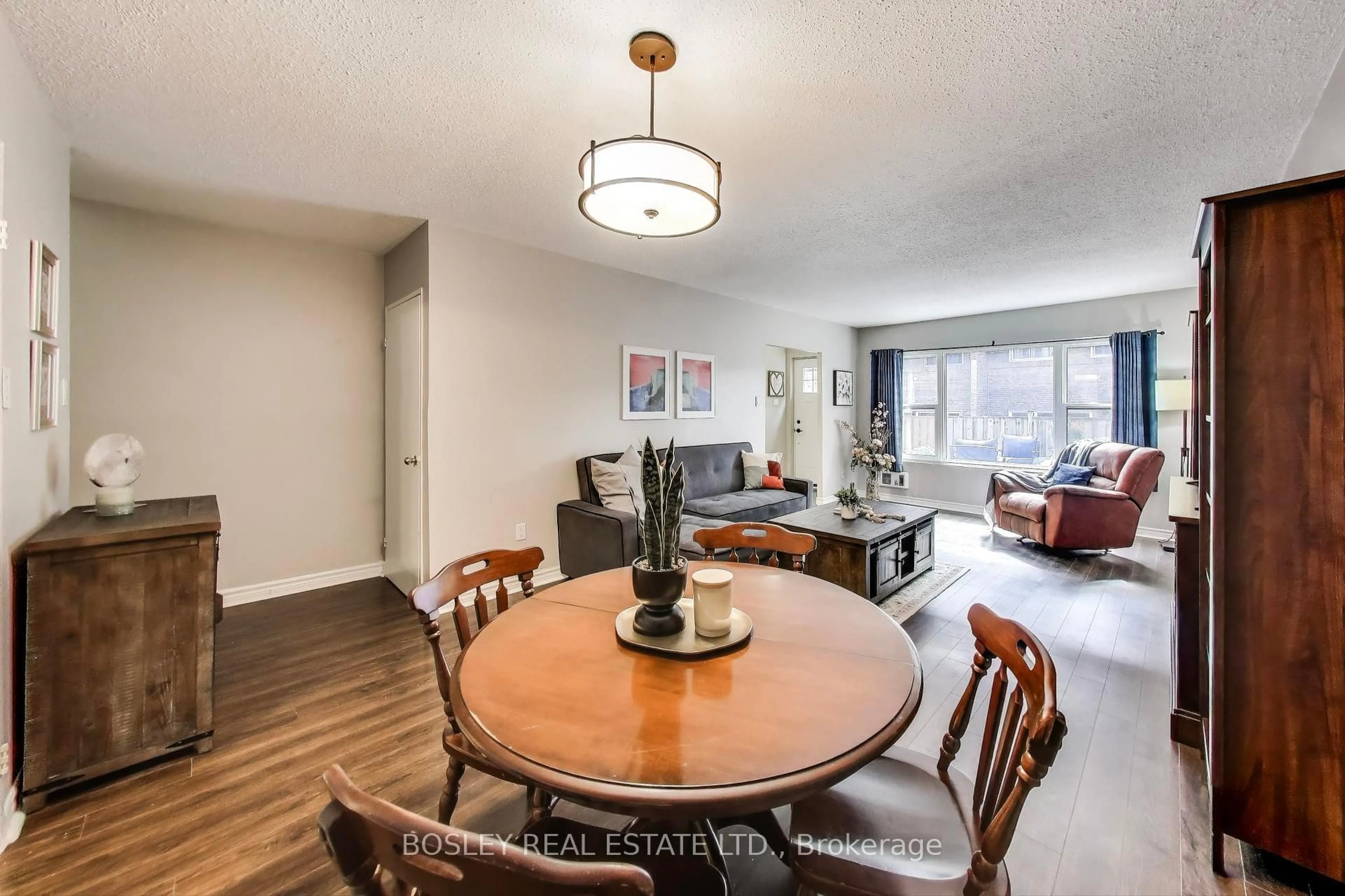 Dining room, wood/laminate floor for 91 Muir Dr #21, Toronto Ontario M1M 3T7