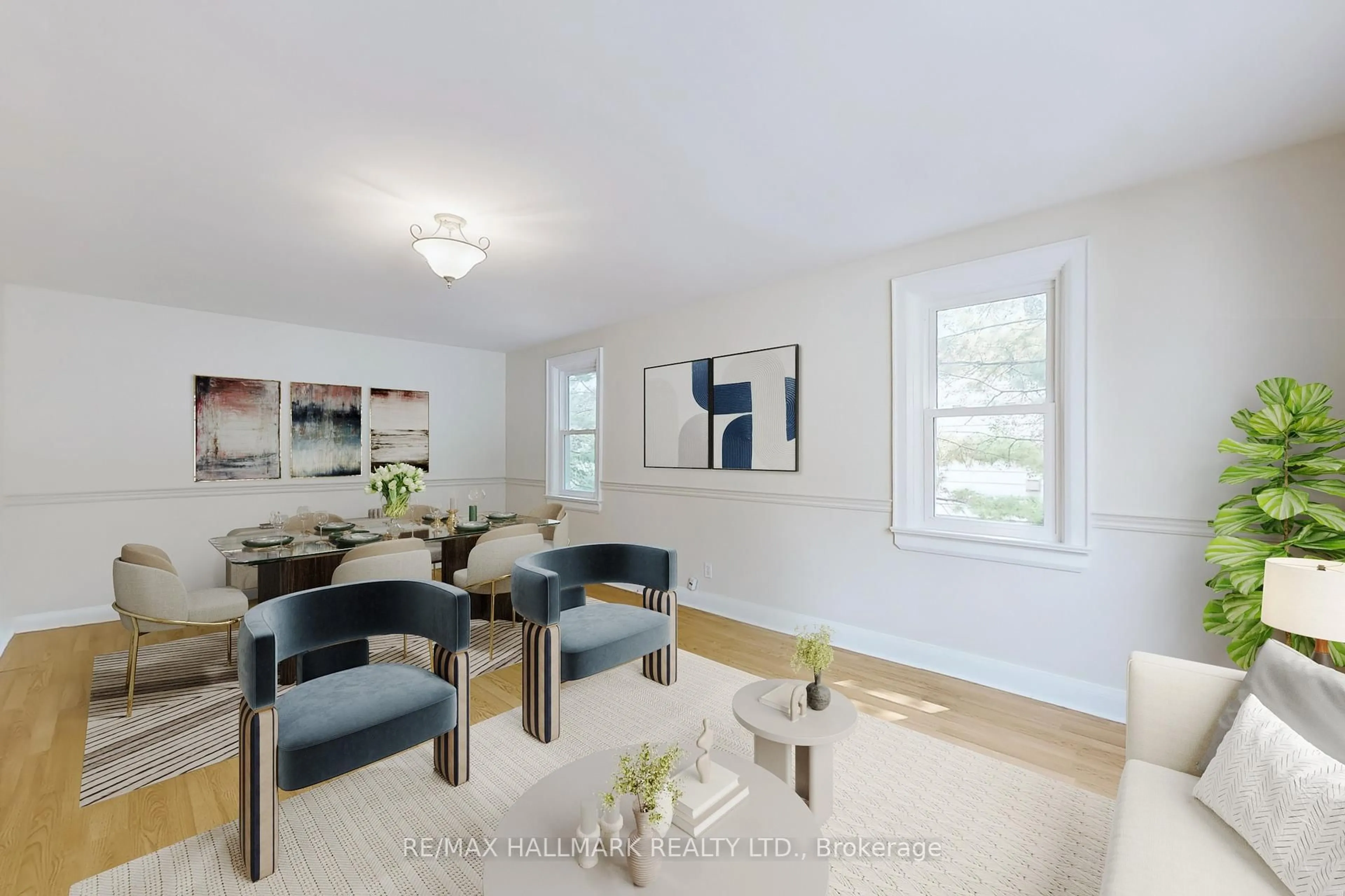 Living room with furniture, wood/laminate floor for 611 Athol St, Whitby Ontario L1N 3Z9