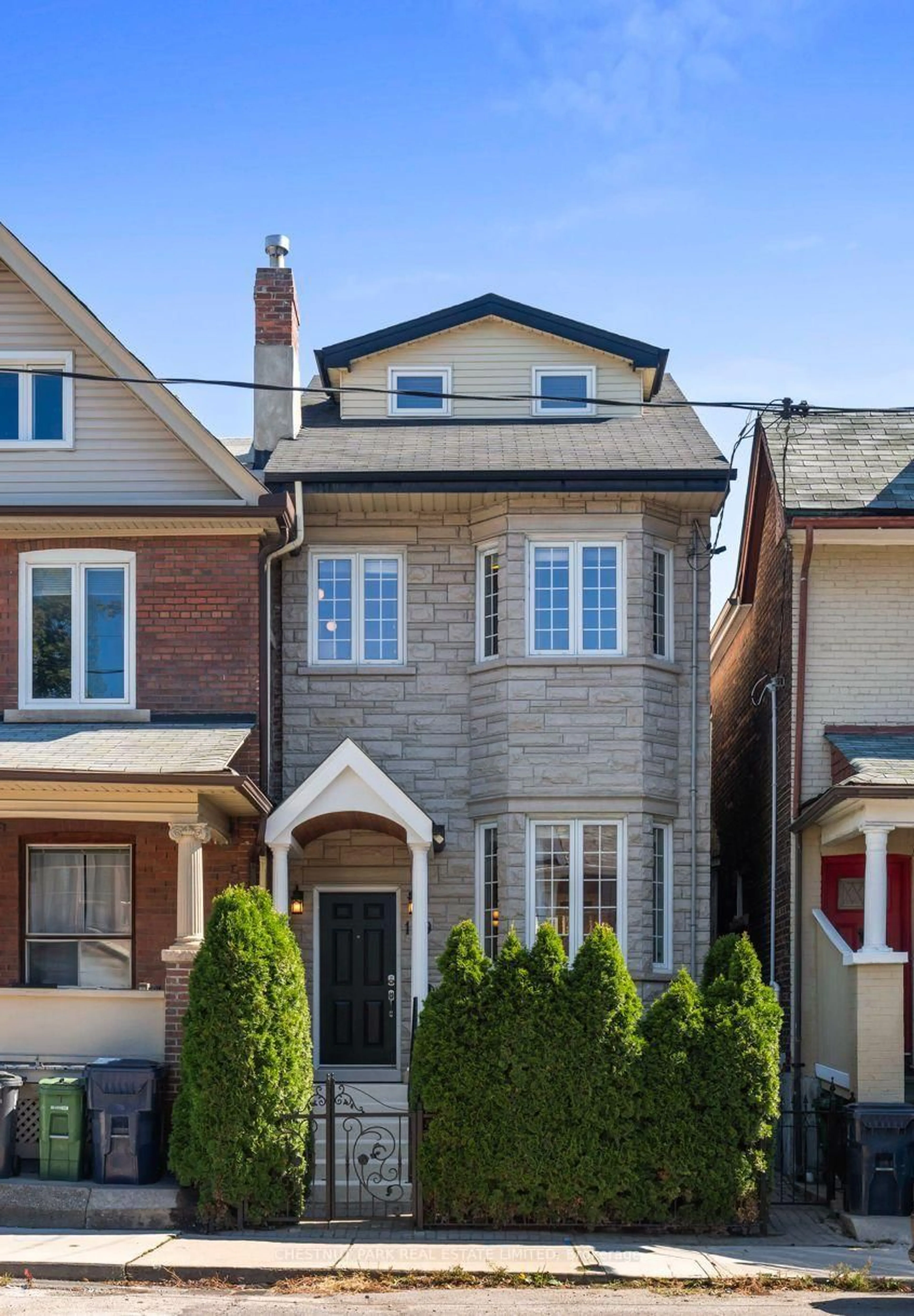 Home with brick exterior material, street for 129 Jones Ave, Toronto Ontario M4M 2Z7